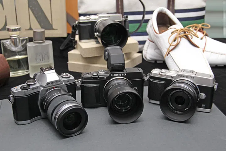 The E-P5 isn't much smaller than the Olympus E-M5, in fact, it's taller with the optional VF-4 electronic viewfinder.