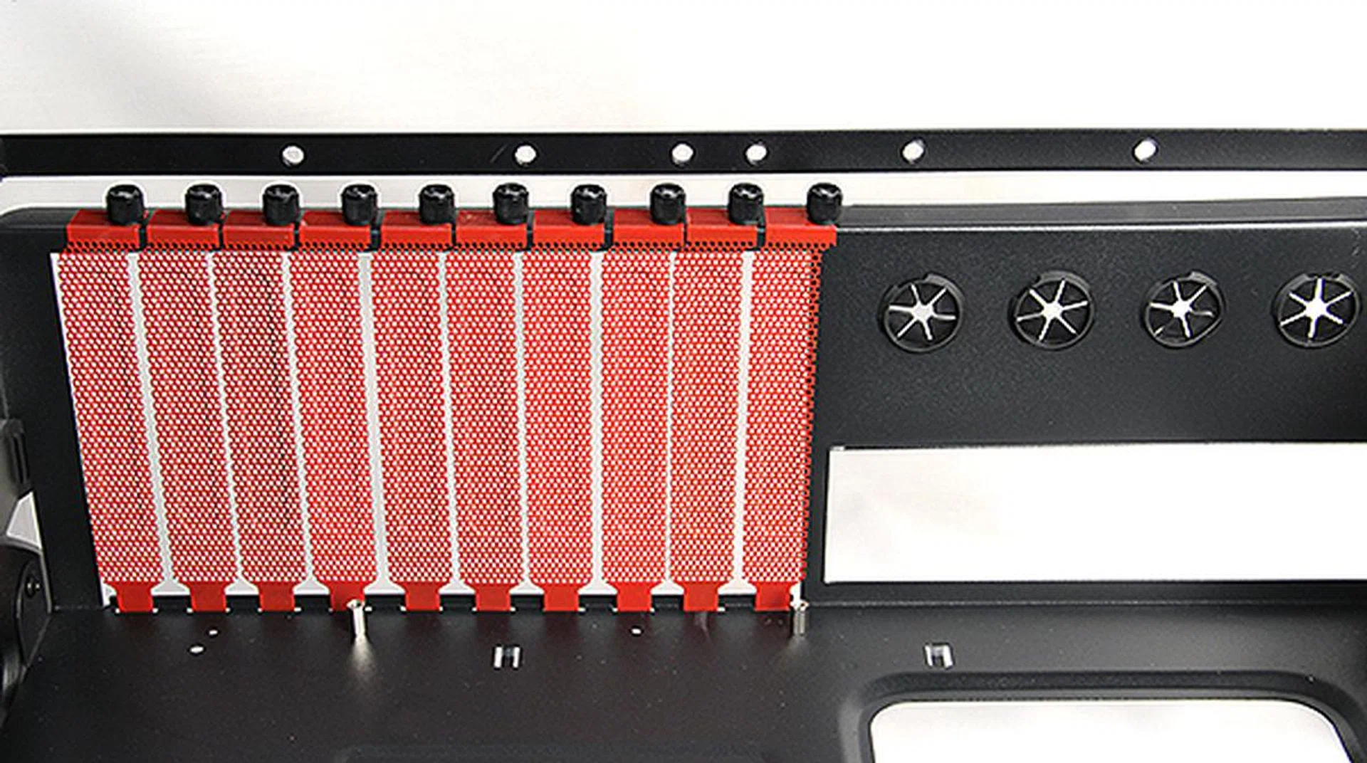 The expansion slot guards are held in place by thumbscrews which can be easily removed.