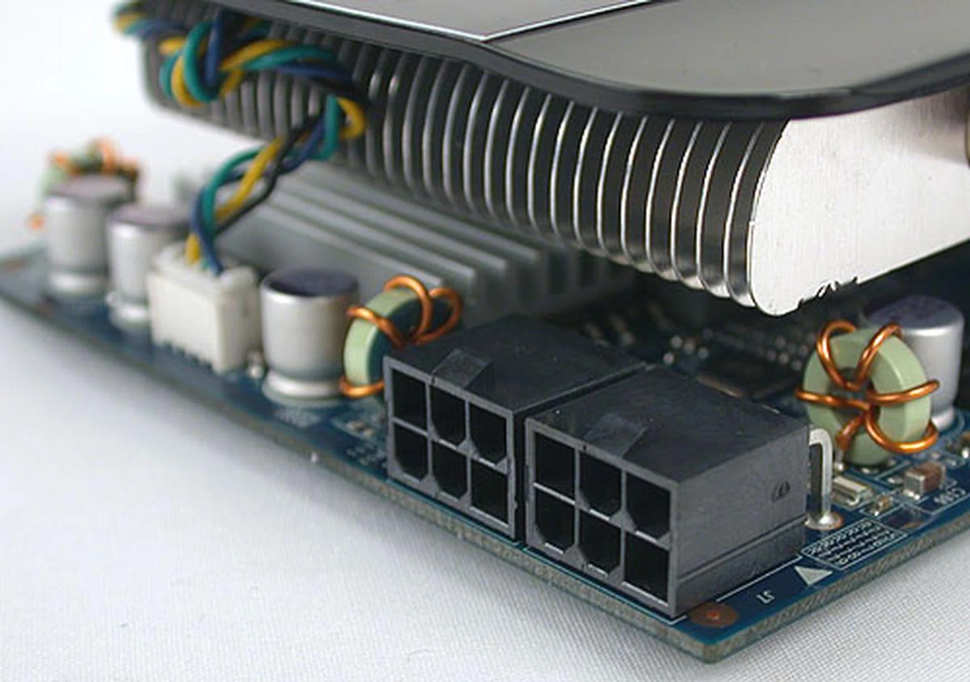 Unlike the ASUS, the power connectors are aligned such that one has to connect them via the front of the card. It's no big deal if you have a large, spacious chassis, or a relatively short card like this ECS GeForce GTX 560. 