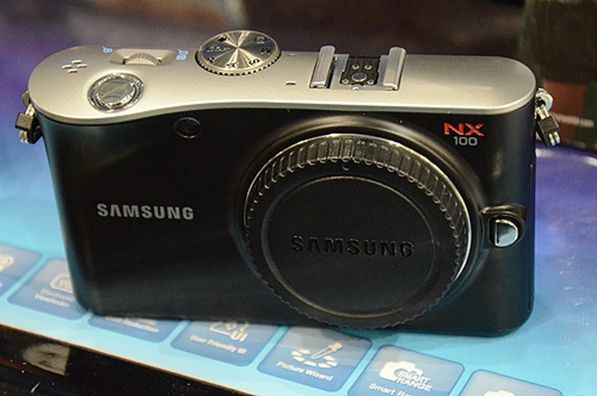 The NX100 has a APS-C size CMOS sensor, 3-inch AMOLED display and is capable of recording 720p HD movies. $949 will net you one with a 20-50mm i-Function lens.