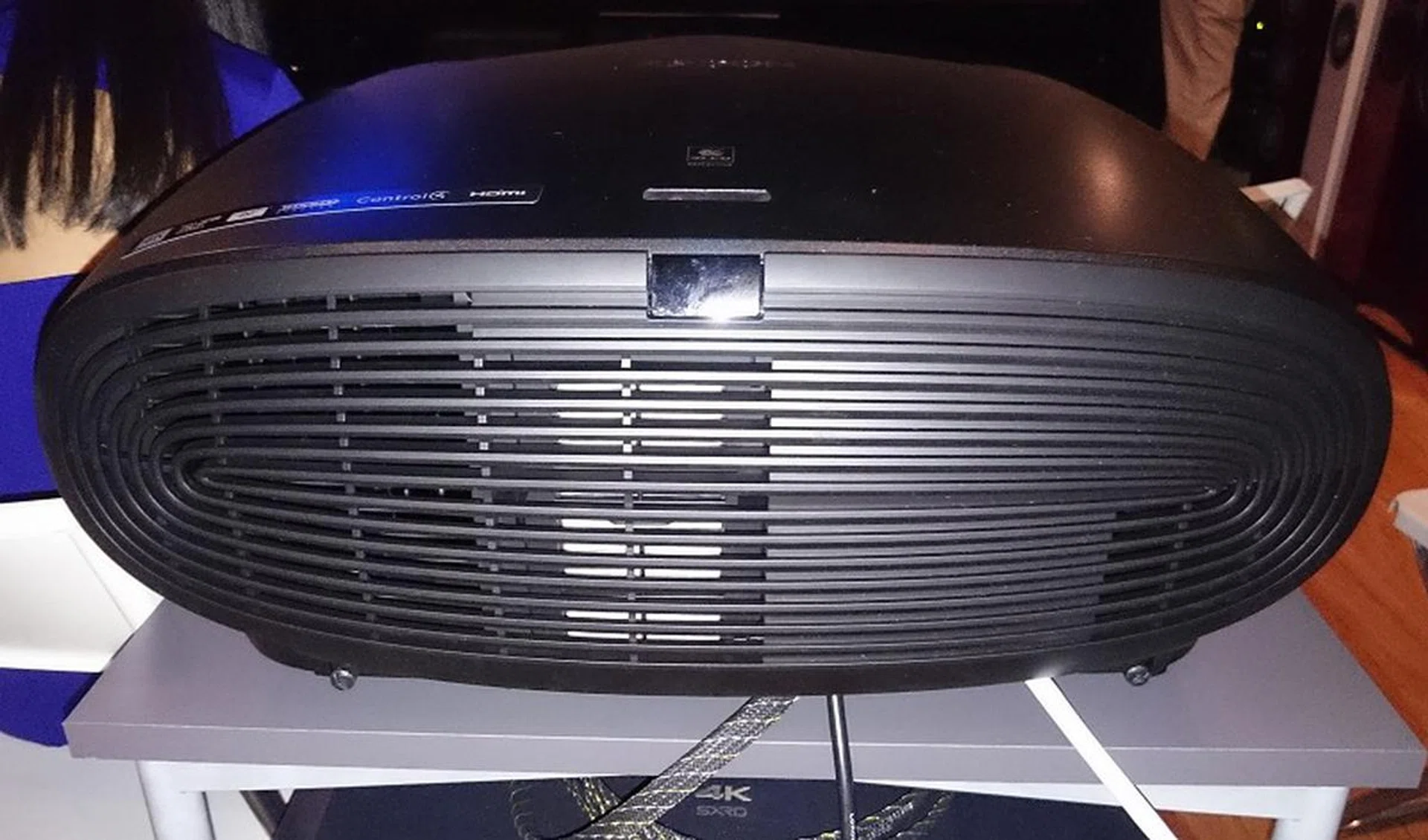 The back of the projector and its panel hiding the rear I/O comprising of dual HDMI ports, Ethernet port, VGA, component, composite video and trigger inputs.