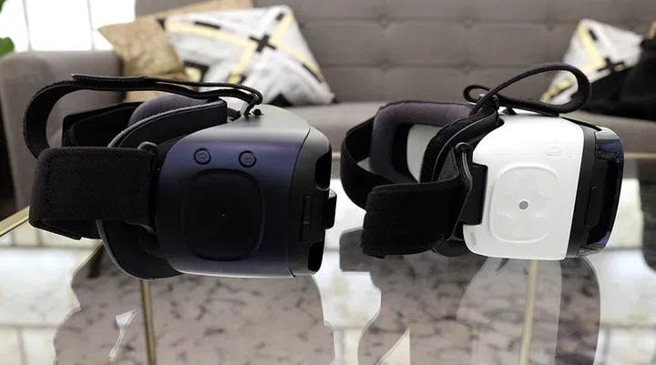 The new Gear VR (left) has a flat trackpad and a dedicated Home button.