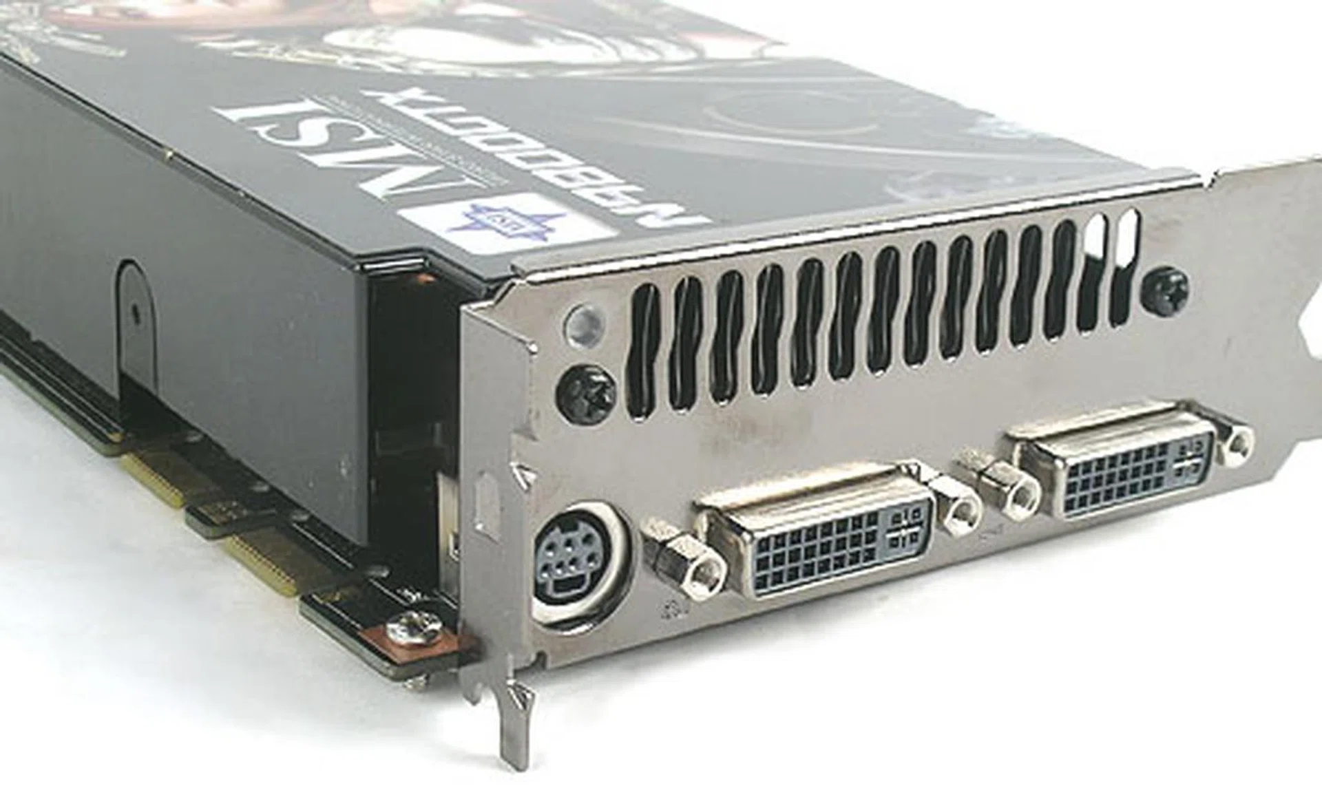 We found the usual set of outputs behind the card and there's also a glimpse of the two SLI connectors that make the GeForce 9800 GTX one of the few cards to support 3-way SLI. 