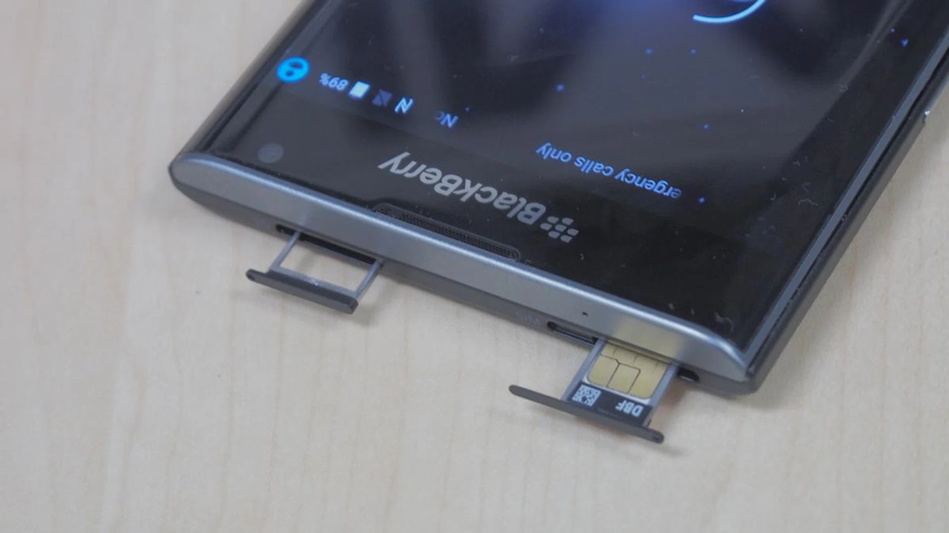 SIM and microSD card slots are at the top of the phone.