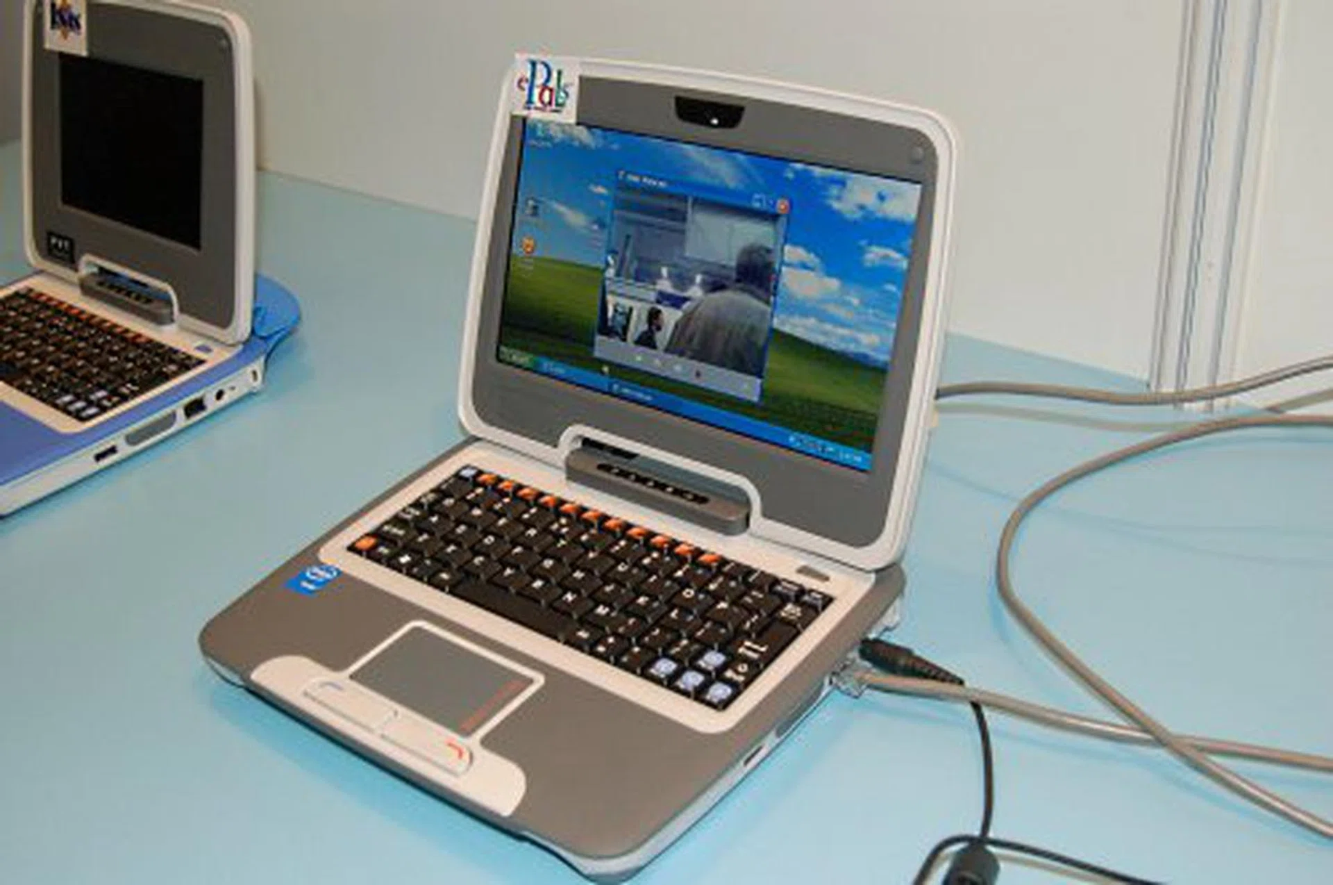 Larger 7-inch screen and black keyboard.