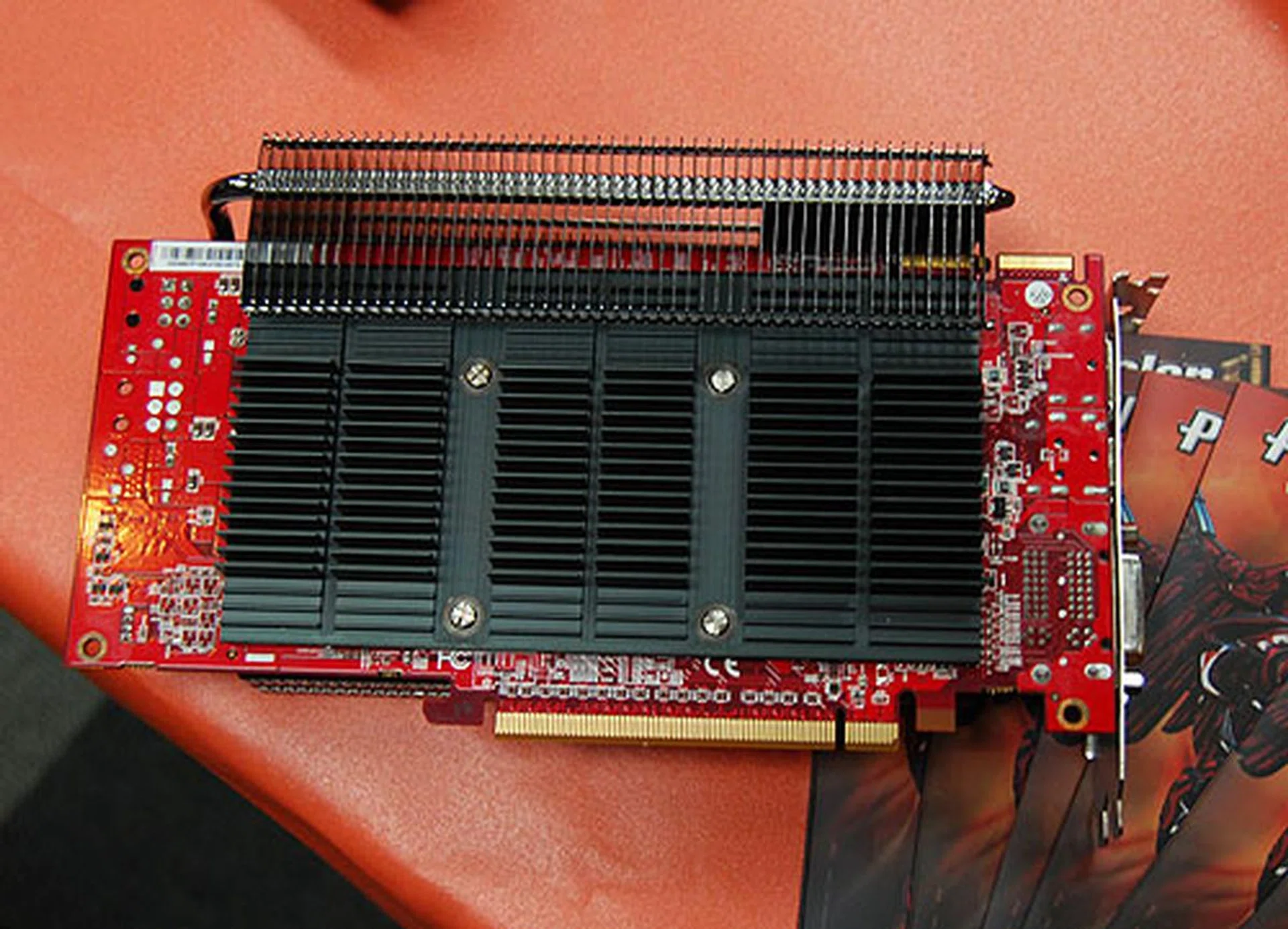 A solid slab of heatsink covers the back of the card.