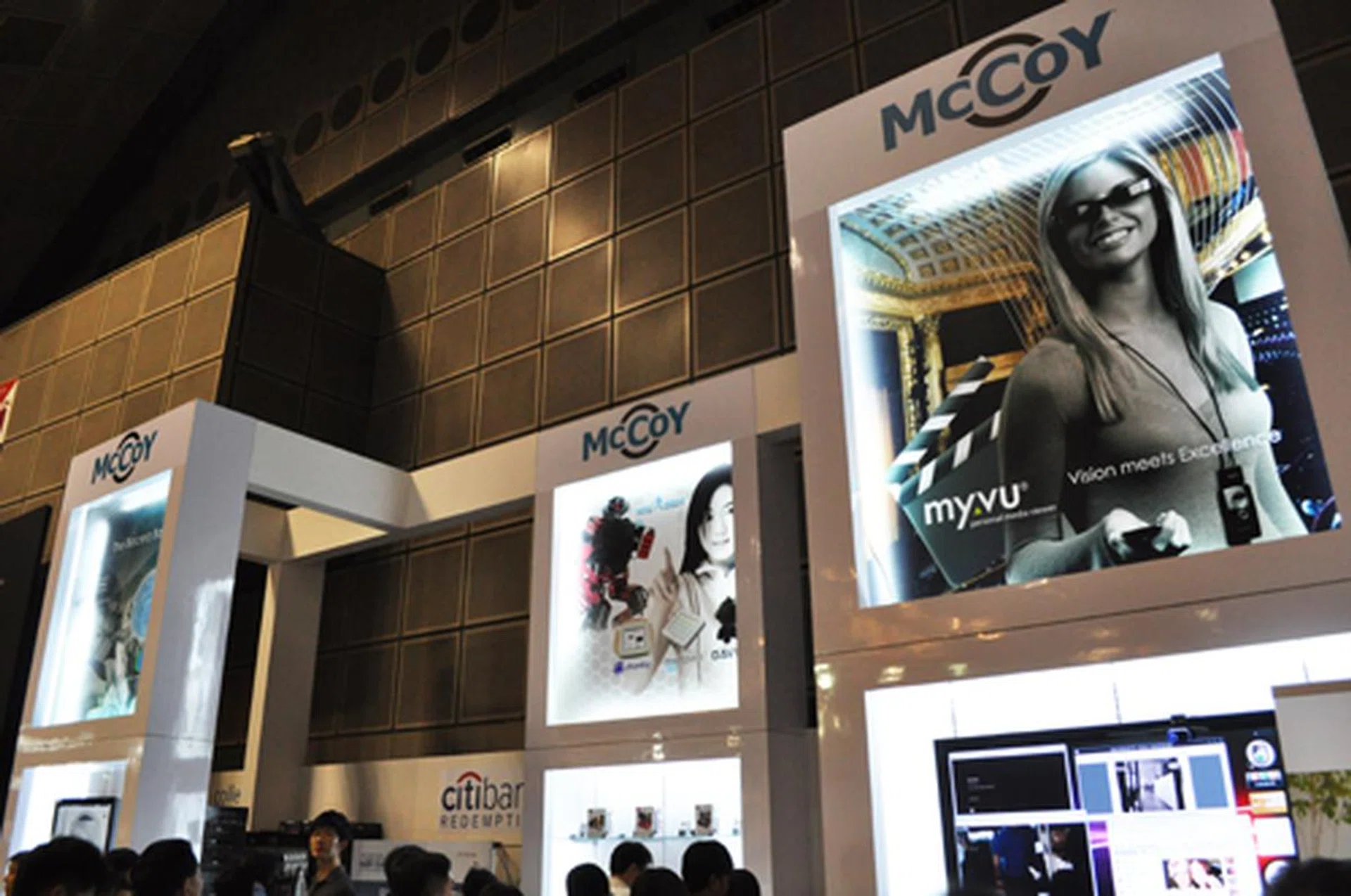 McCoy's booth is on the 6th floor, just besides the central entrance.