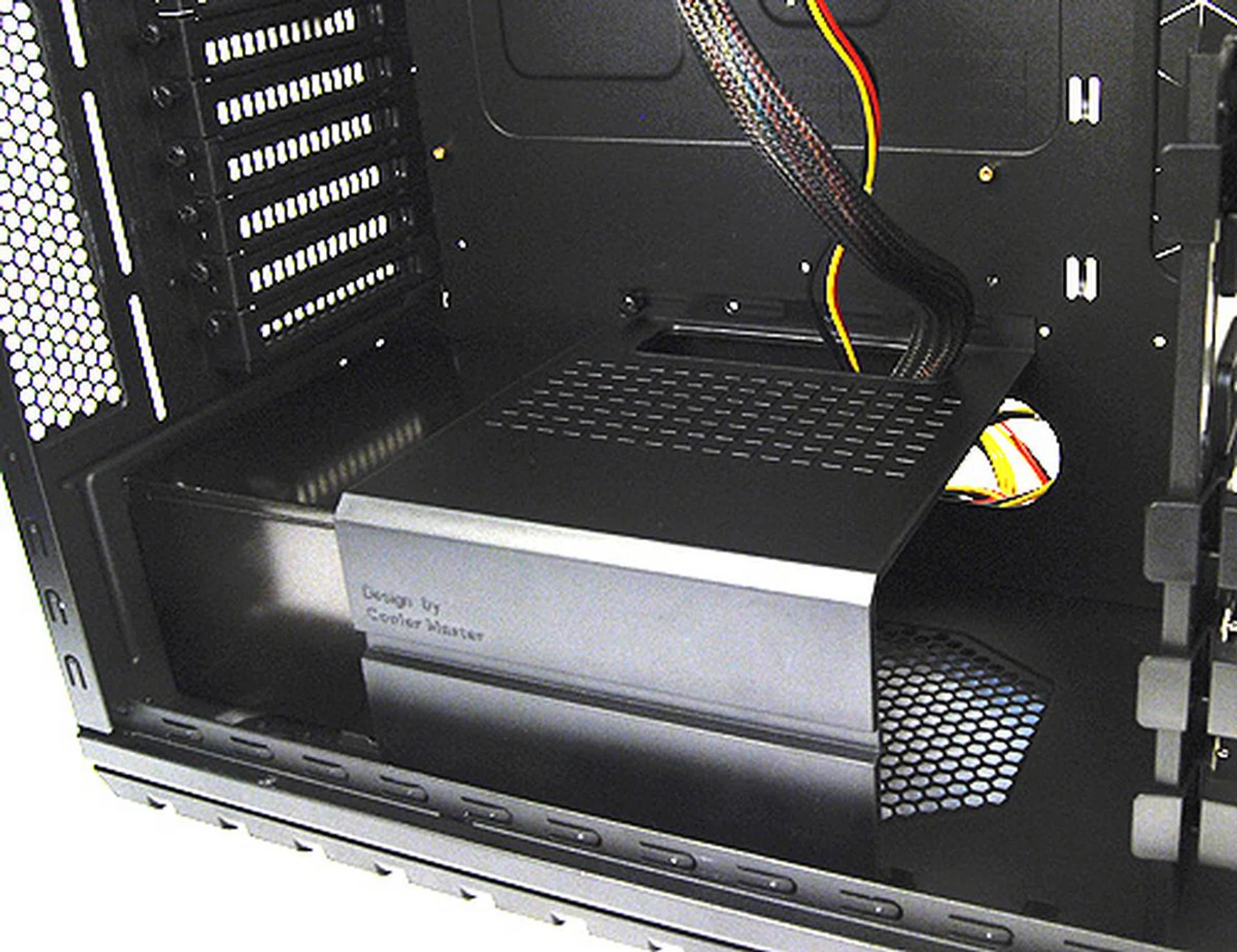 There's also this special rack for your PSU that not only secures larger PSUs in place, but the cut-out at the back also allows you to route necessarily cables around the front, while the others can be routed around the back of the motherboard tray for neater cable management.