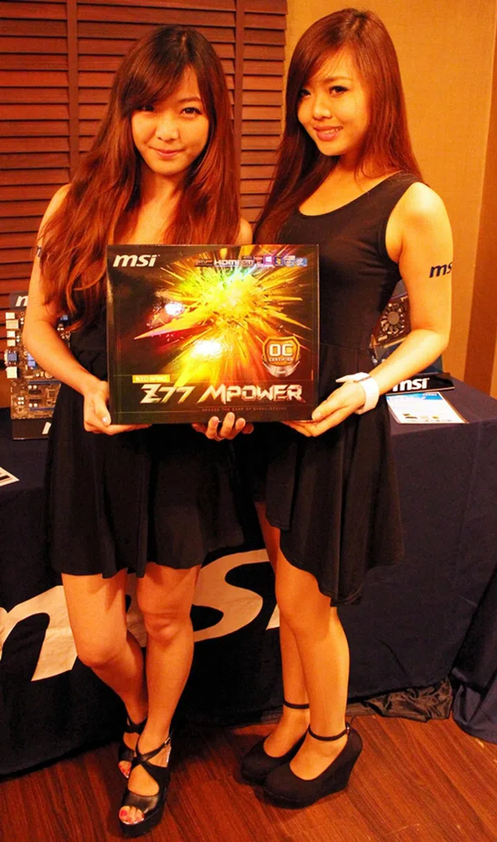 The MSI ladies posing with the lucky draw grand prize, the MSI Z77 MPower motherboard.