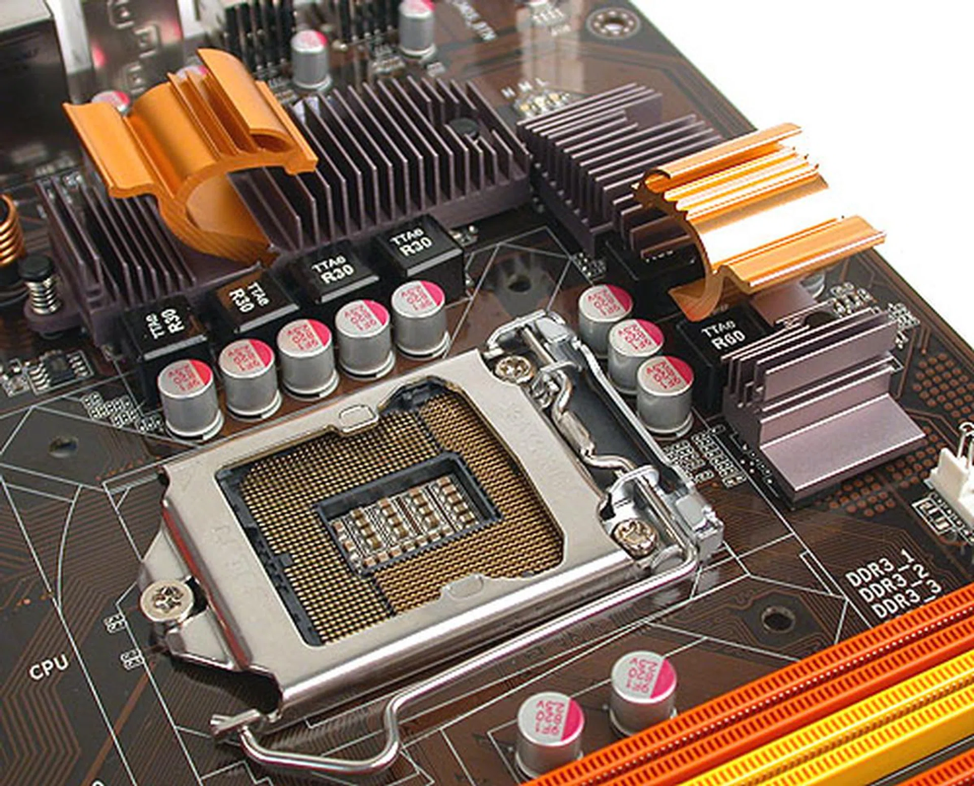 We counted six chokes around the CPU, which presumably means this board has a six-phase power design. Solid capacitors dot the rest of the board. The twirl design of the heatsink seems to be cosmetic and there are no heat pipes connecting them.
