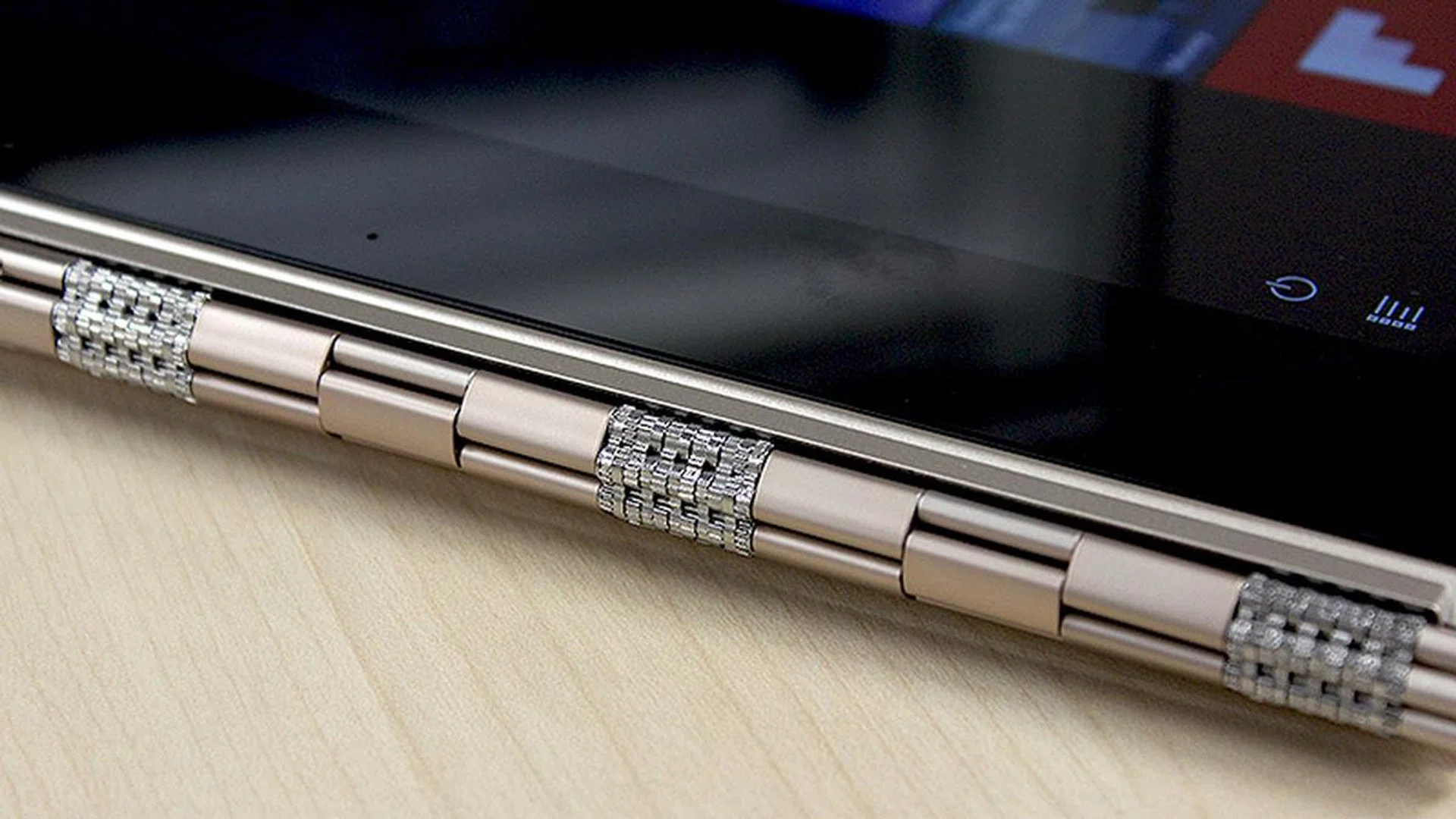The Yoga 910's signature watchband hinge is really pretty, but doesn't actually really do much more than the Spectre x360's plainer-looking hinges.
