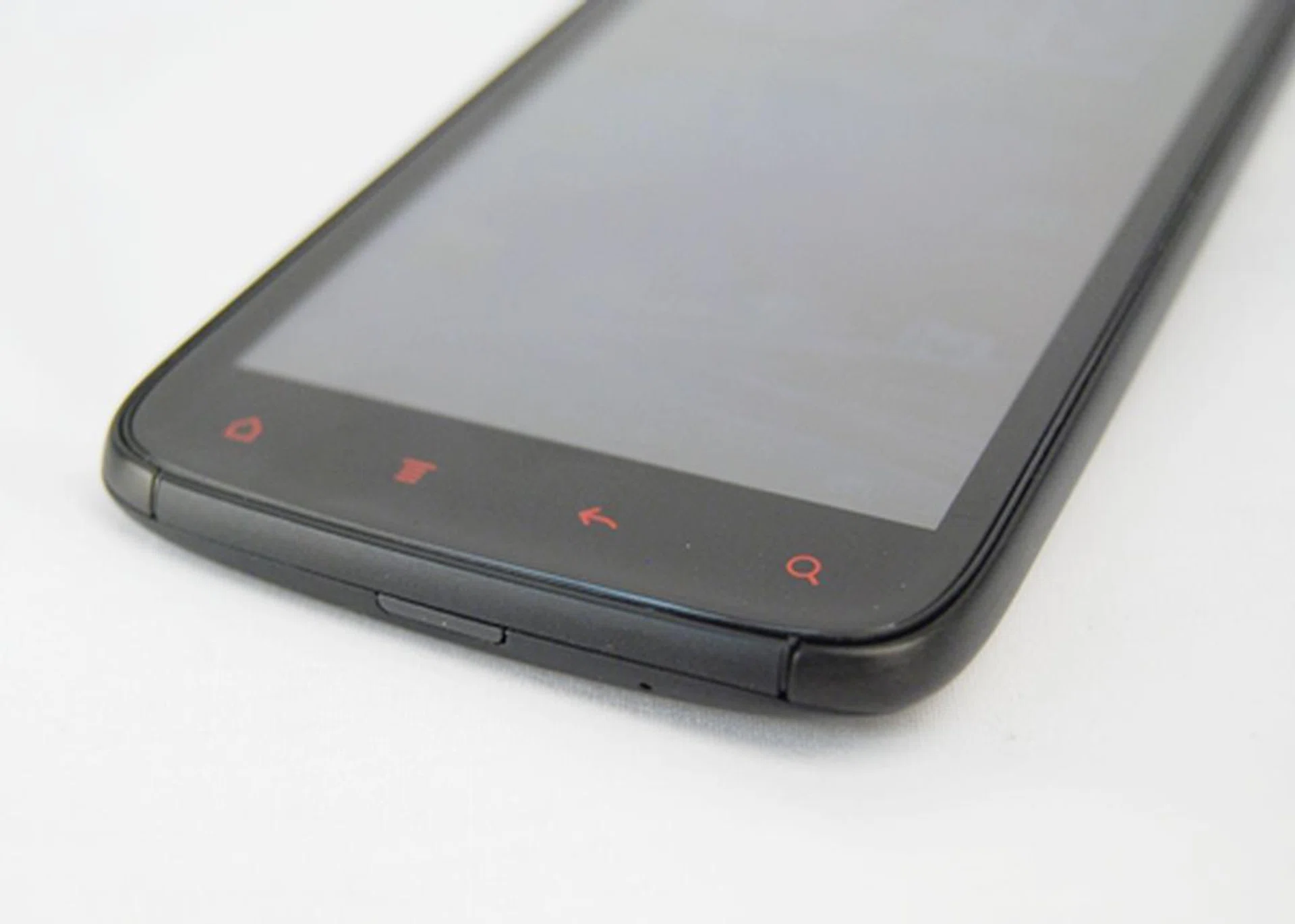 The touch controls are also tinted with red as opposed to white on the Sensation.
