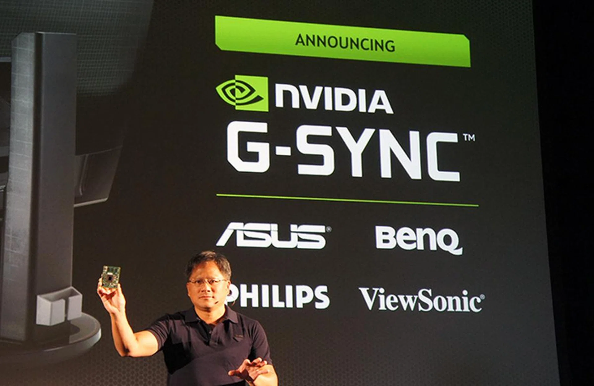 NVIDIA CEO Jen-Hsun Huang announcing NVIDIA's new G-Sync technology. Here, we can see him holding up the special module that monitors will need to support this technology.