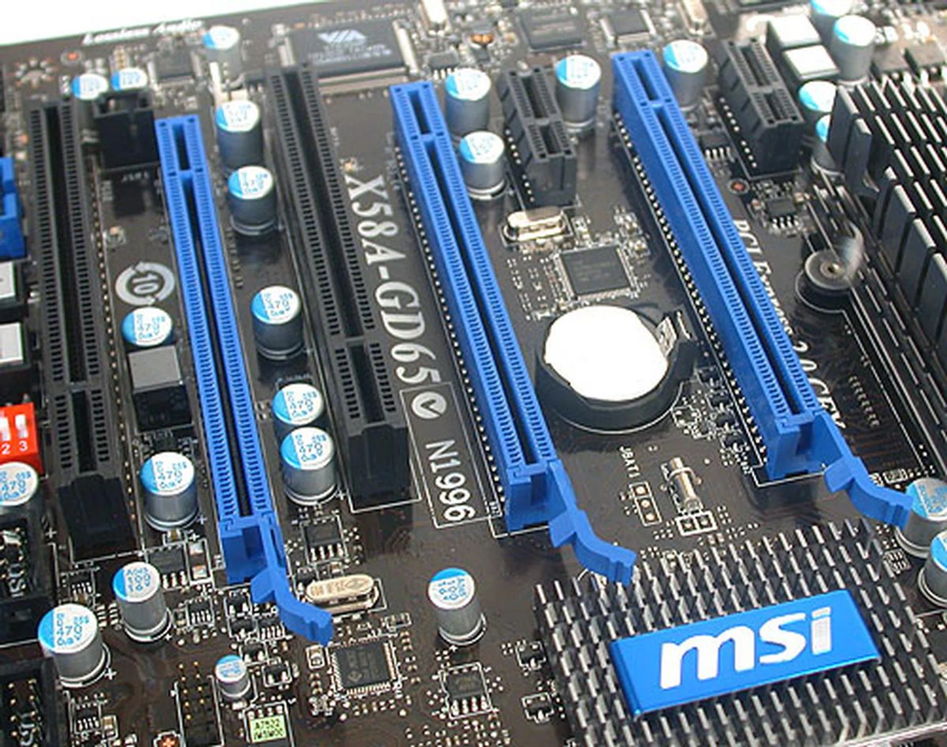 With three PCIe 2.0 x16 slots spaced out evenly, it's no surprise that this board can support 3-way SLI/CrossFireX. Looking at the right, while MSI has tried to put the heatsink out of the way of the PCIe x1 slot, it still seems a tad insufficient to us for anything but a short expansion card. 