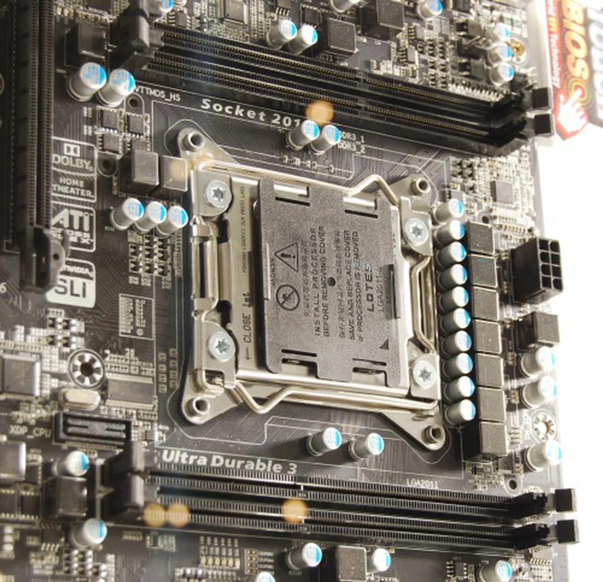 That mean, each of the four DIMM slots on this board is matched with a corresponding memory channel on the upcoming Sandy Bridge-E monster processor. We do literally mean "monster" since this processor requires a brand new LGA2011 socket which is physically a lot larger than what we've seen for consumer CPUs. Despite its bulky look, it's supposed to be compatible with LGA1366 coolers.