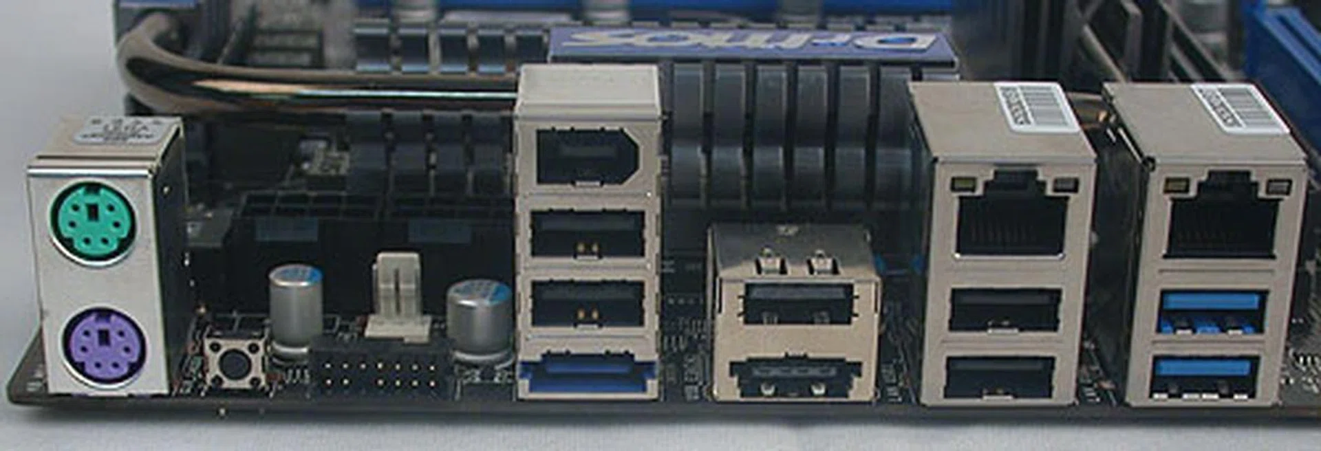Besides the PS/2 ports, there's a small button to reset the BIOS and the special connector to link the board to MSI's OC Dashboard, which is an external display that shows relevant system information like temperature and voltages. You can even adjust and tweak settings via this Dashboard. Other ports here include dual Gigabit LAN, a pair of USB 3.0 ports, eSATA and FireWire.