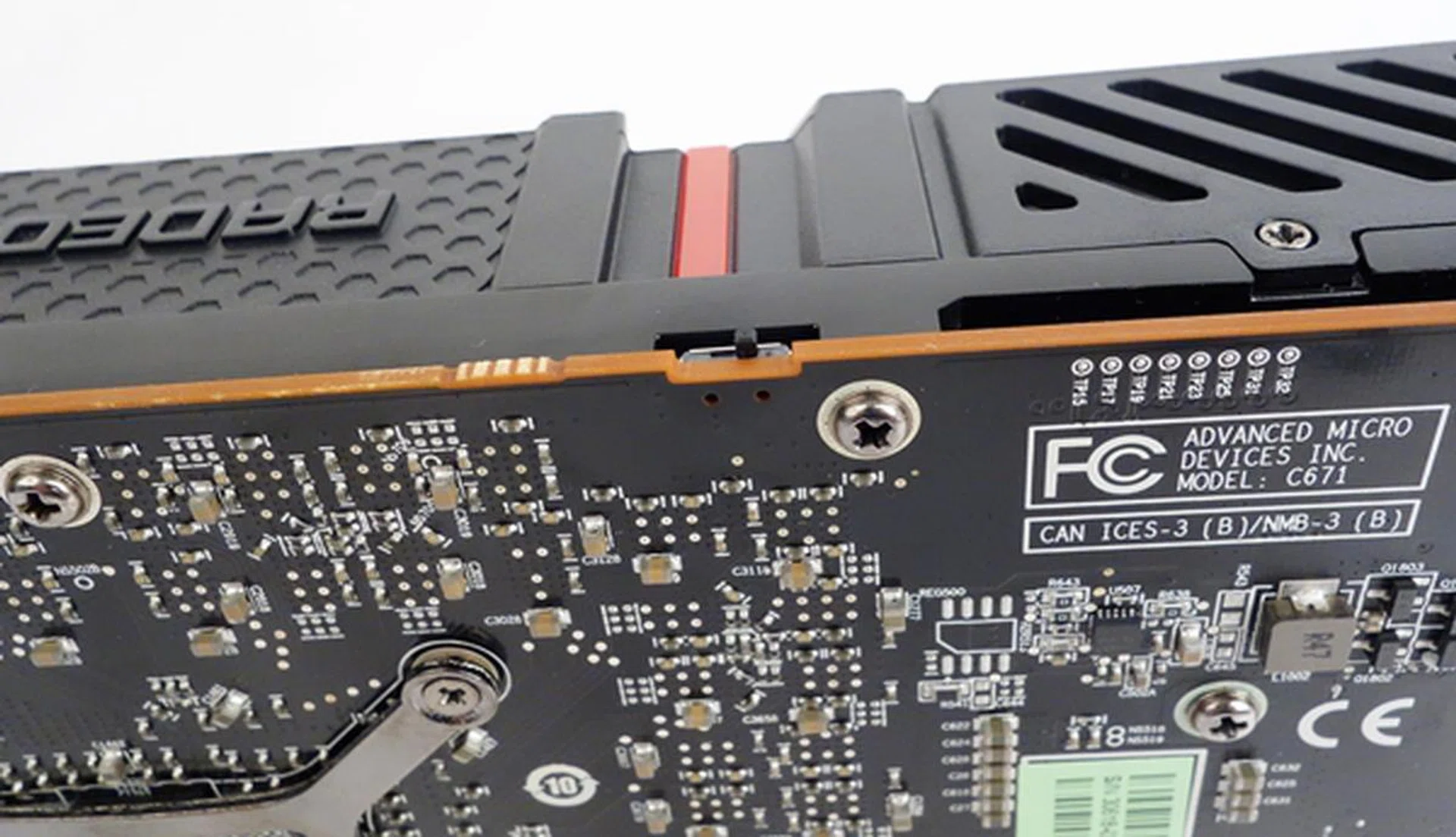 The BIOS switch is shown in the quiet mode position. By pushing the switch over to the opposite side, the card will be in uber mode. The system needs to be switched off before the BIOS switch is moved.