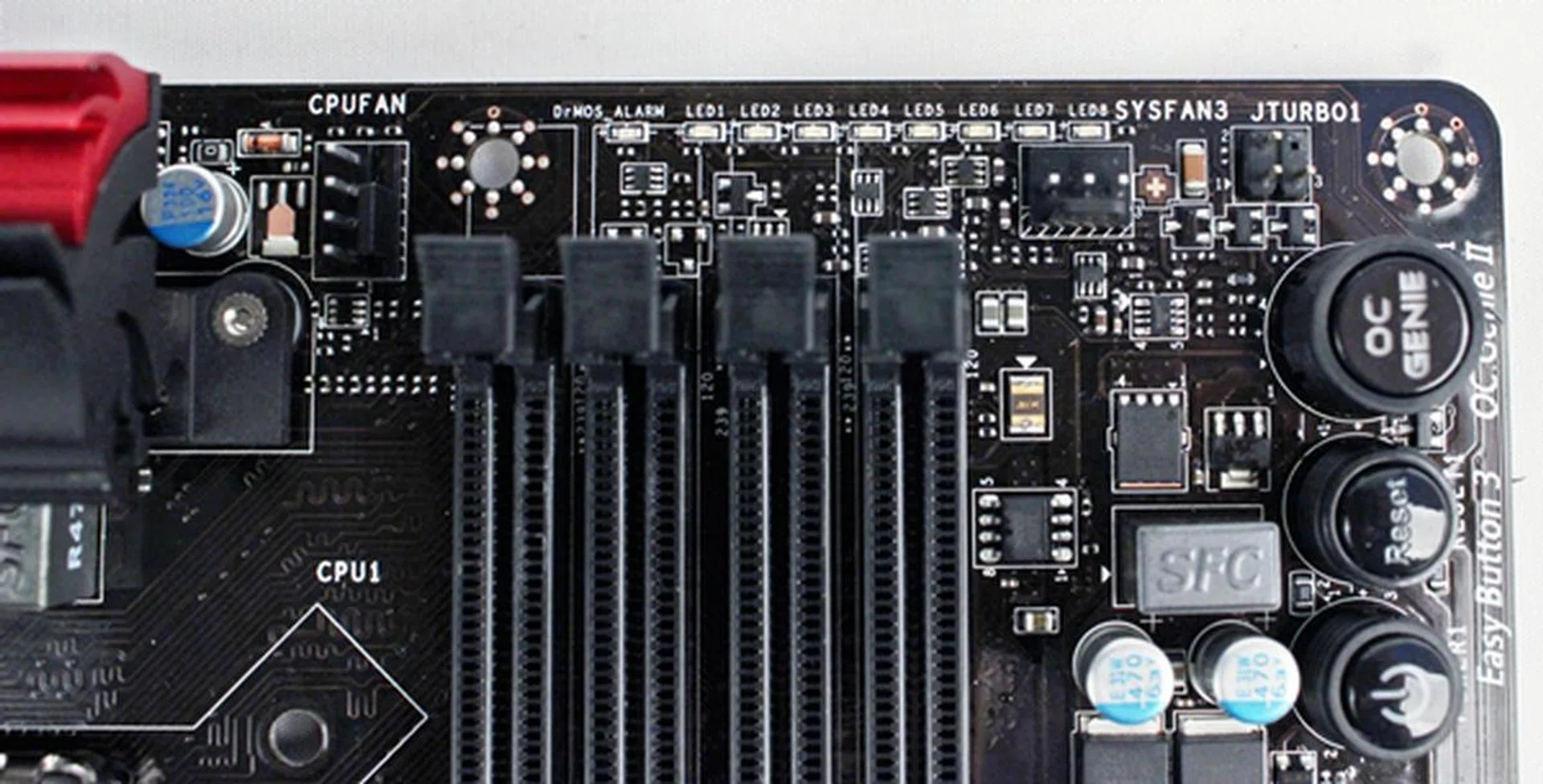 It is rather cluttered at this edge of the board with two fan connectors located very close to the DrMOS and CPU Power Phase LEDs. At the adjacent edge, we see the three on-board buttons that are called Easy Button 3.