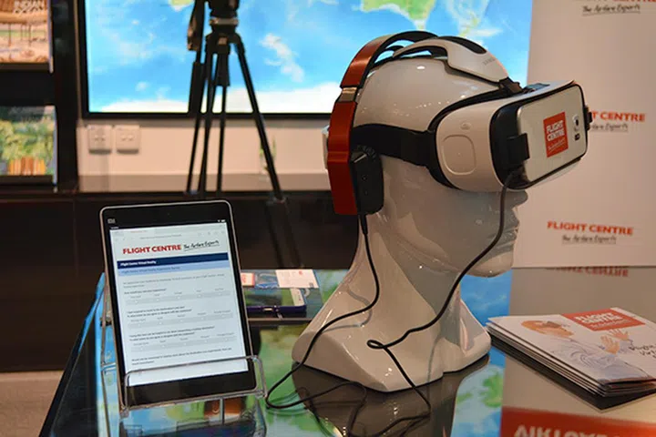 Flight Centre uses Samsung Gear VR Innovator Edition headsets for its VR experience. A digital feedback form on the tablet beside it encourages customers to leave feedback. 