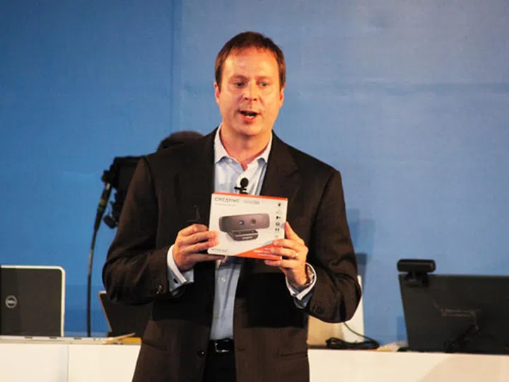 Kirk Skaugen, senior vice president and general manager of Intel's PC Client Group with the retail version of the Creative Senz3D interactive gesture camera.