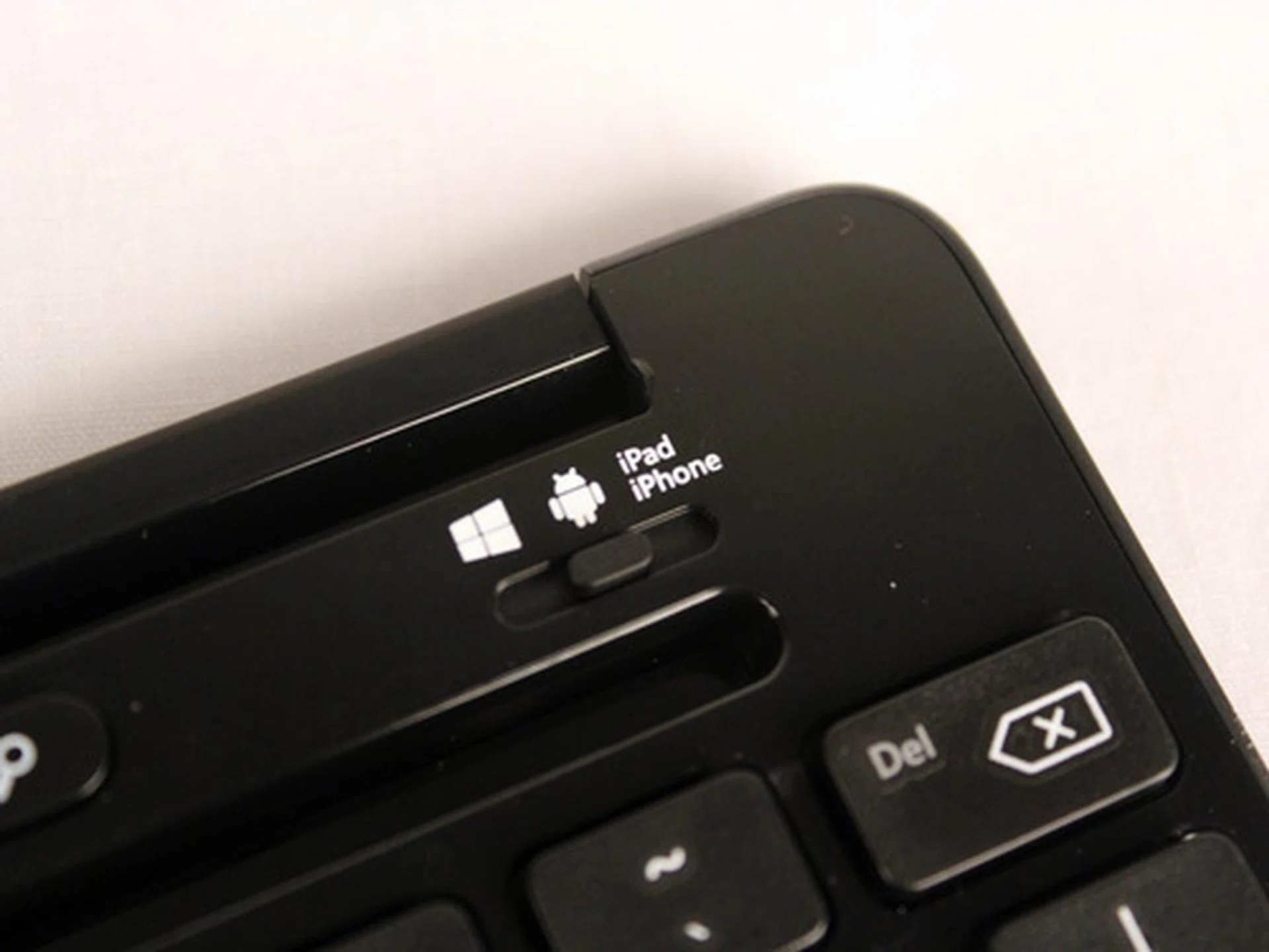 The toggle is easily accessible near the top of the keyboard, while being somewhere that's unlikely you'd hit while typing.