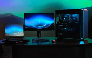 Alienware Area-51 laptop, 27-inch 4K QD-OLED gaming monitor and Area-51 desktop. This is someone's downpayment for a car loan on a table. Photo: Dell.