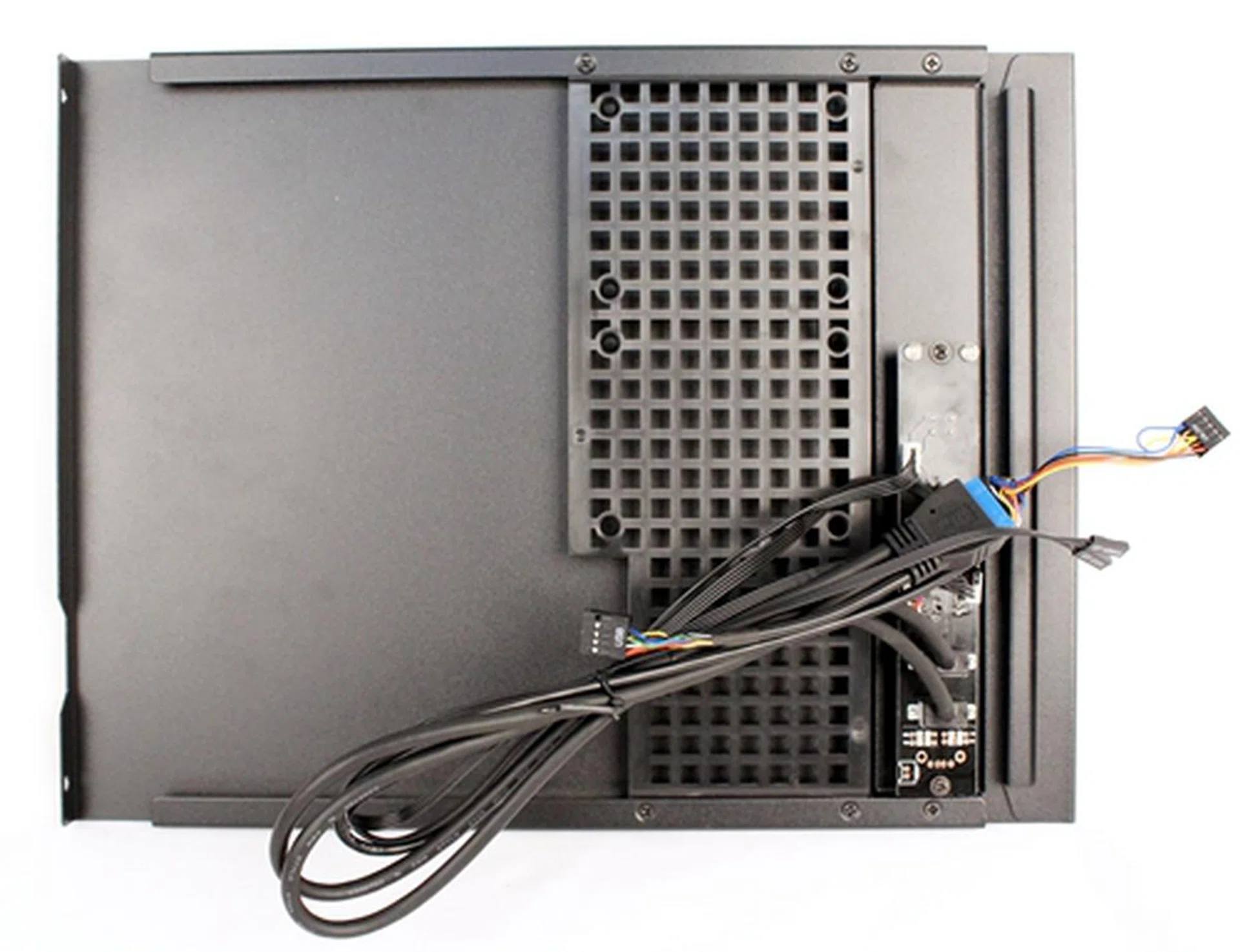 The side panel, with the buttons and I/O ports, has a lattice sleeve with two compartments for 2.5-inch drives.