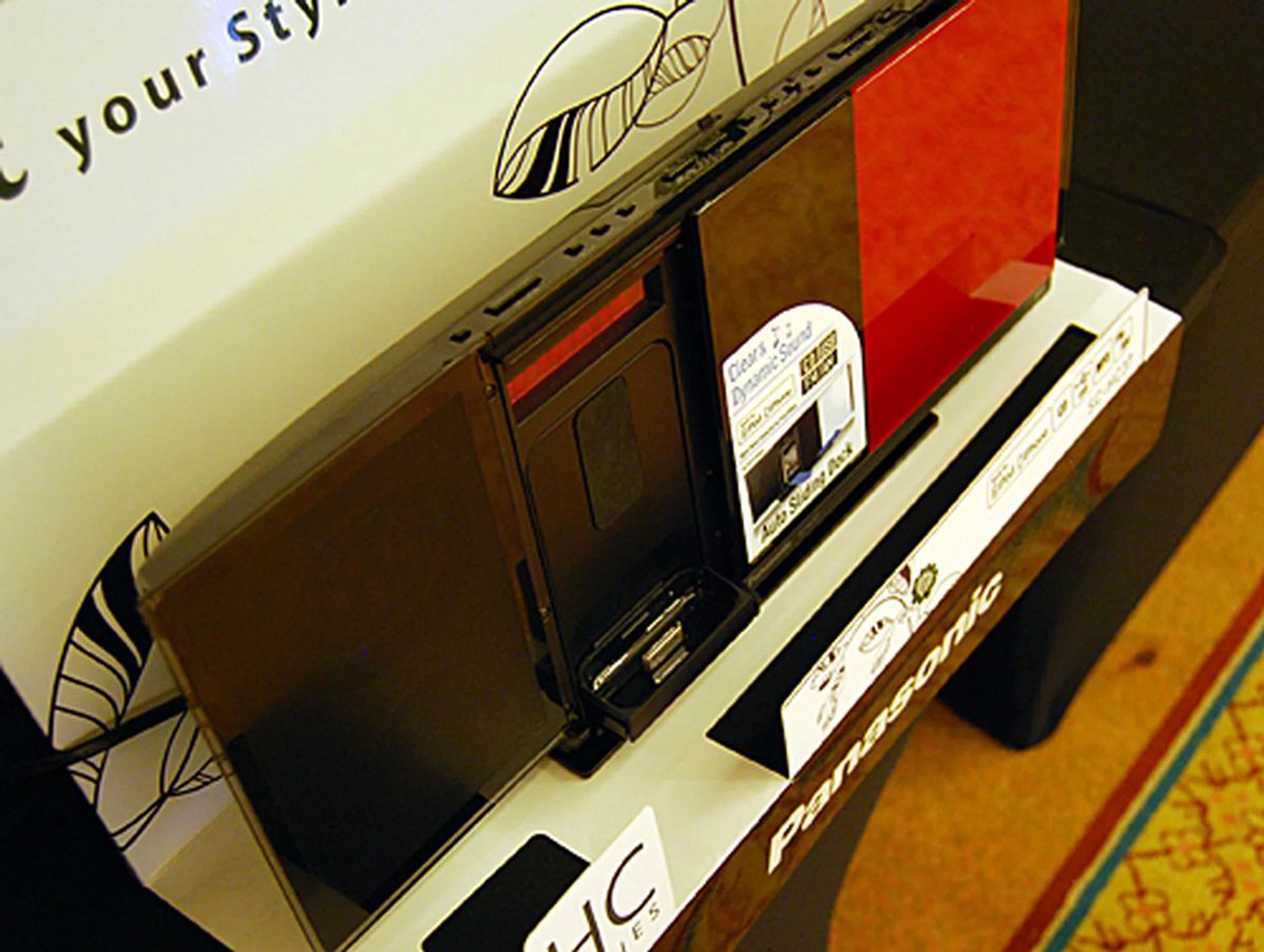 The Front Panel of the SC-HC37 slides across to reveal the proprietary dock intend for the iPhone and iPod Touch.