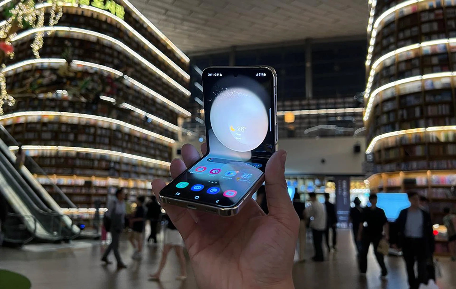 Samsung Galaxy Z Flip5, half-folded, at Starfield Library, Coex Mall, Gangnam, Seoul.