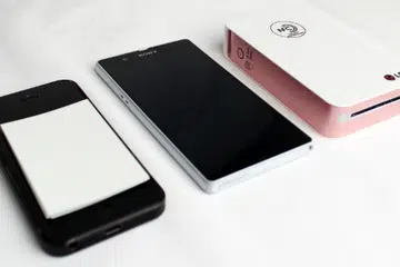 Pictured here (from left to right) is the iPhone 5, Sony Xperia Z and the LG Pocket Photo. The Zink paper is also placed on top of the iPhone to give you a reference on how large your prints will be.  