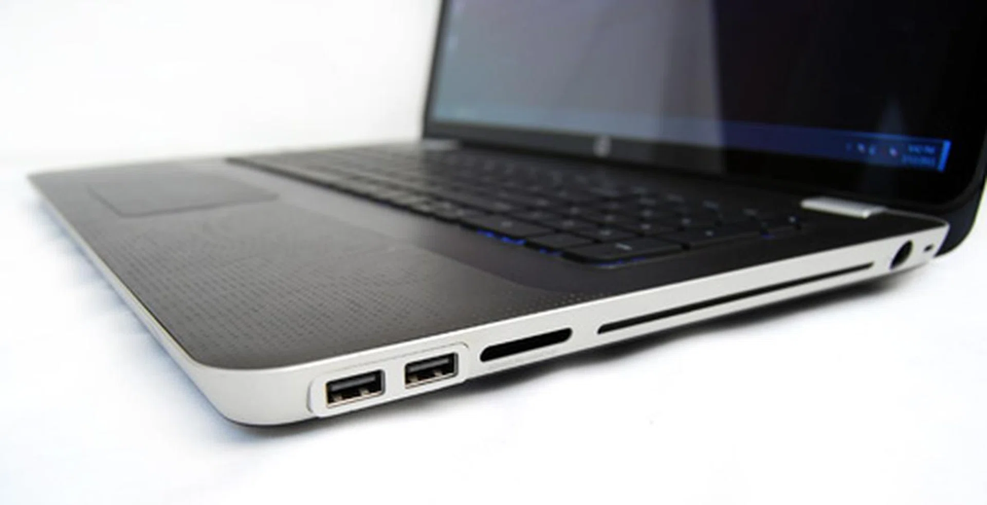 The right side has two USB 2.0 ports, 5-in-1 card reader, a slot-load Blu-ray drive and the power port.