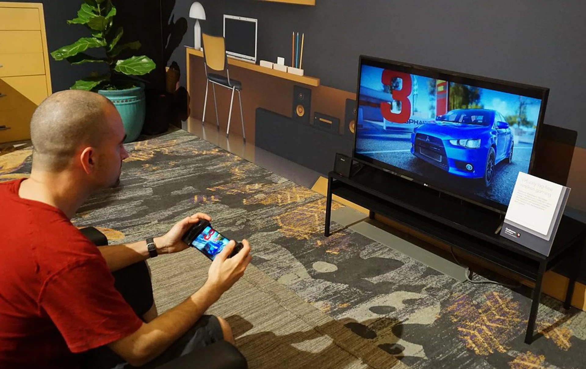 Qualcomm showed off a use-case with 802.11ay Wi-Fi standard with virtual lag-free wireless gaming where you can mirror your phone’s display to the big TV screen to game with ease and this was facilitated by an ASUS pre-production 802.11ay access point.