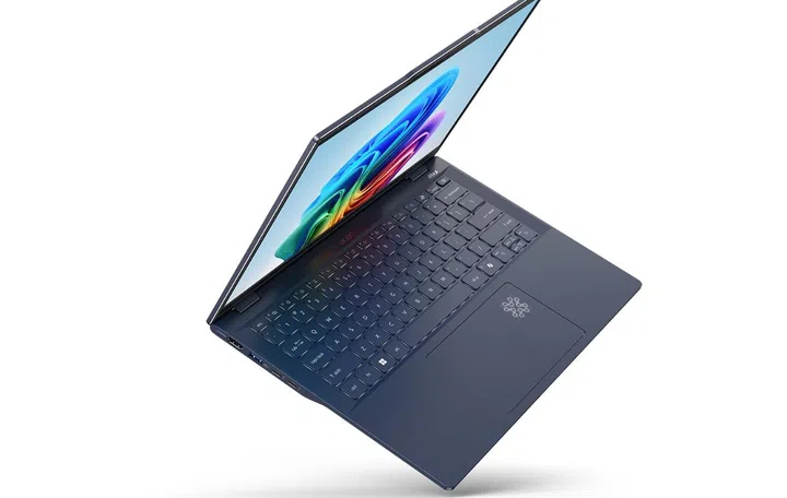 The Acer Swift 14 AI. You can see the spot on the touchpad that lights up when AI is at work. Photo Acer. 