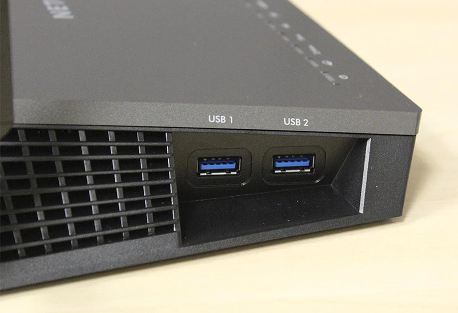 To the left of the router are two USB 3.0 ports. Note the vents at the side which help keep the router cool. 