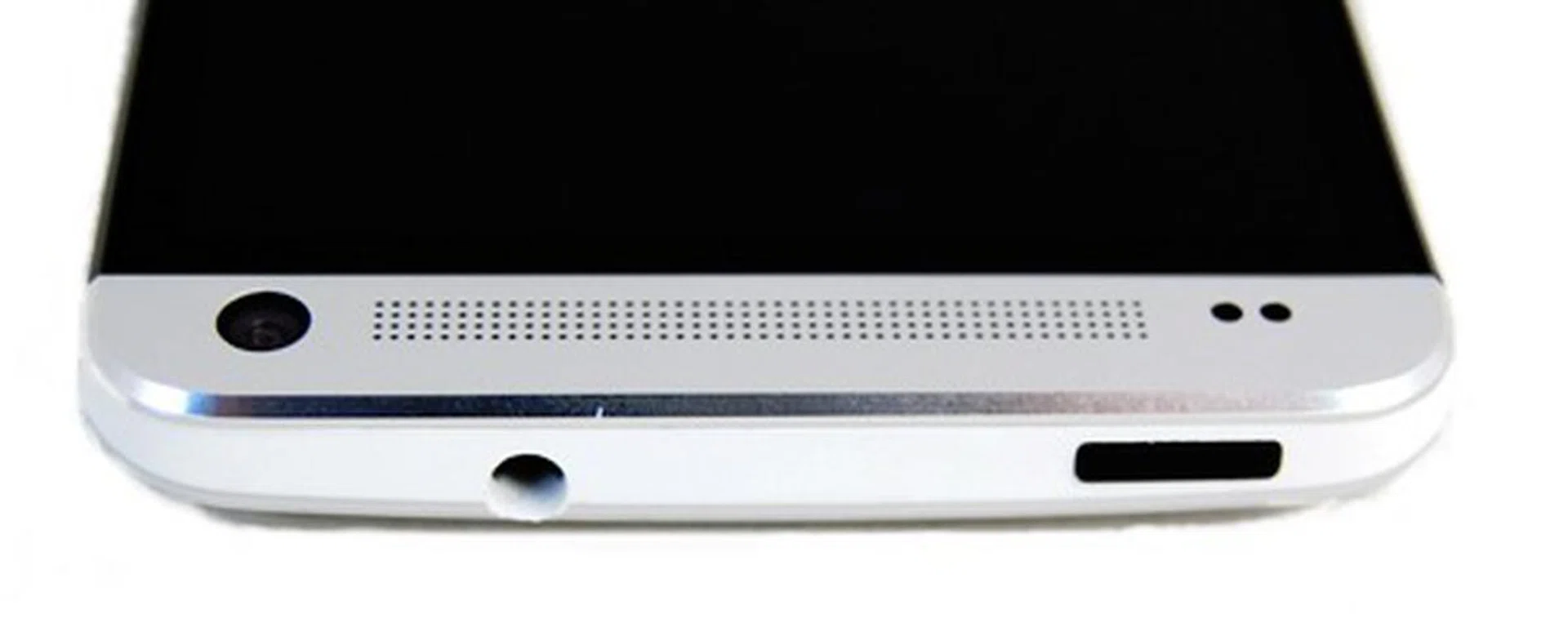On the top, you will find the 3.5mm audio jack (left) and the power button (right). Evidence of the curved nature of the back can also be observed.