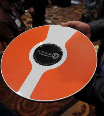 This disc-like object called the 3Drudder, is made for feet-based navigation input. It’s especially useful when you’re immersed in a VR world where you may have your hands busy with other forms of input devices and you can use your feet to help in navigational needs by tilting in the desired direction – sort of like what you would do on a Segway. 