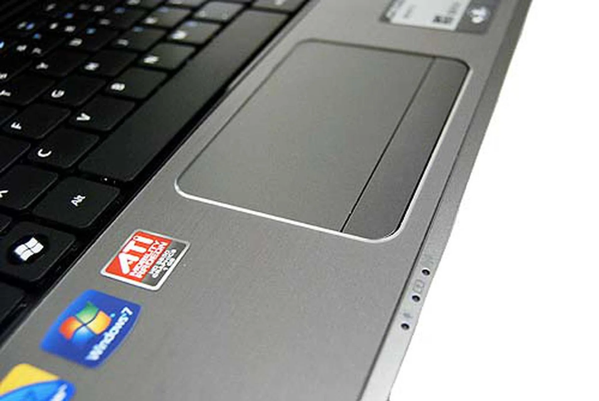 The palm rest goes for a brushed metal feel while the trackpad is as easy to use as ever. The trackpad lock button has also been removed, but its function is replaced by a Fn+F7 key-press.