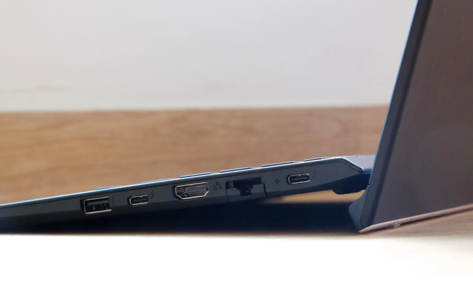 The Vaio SX14 has both USB-C and USB-A ports and even HDMI and a Gigabit Ethernet jack. Note how the display cover props the notebook up.