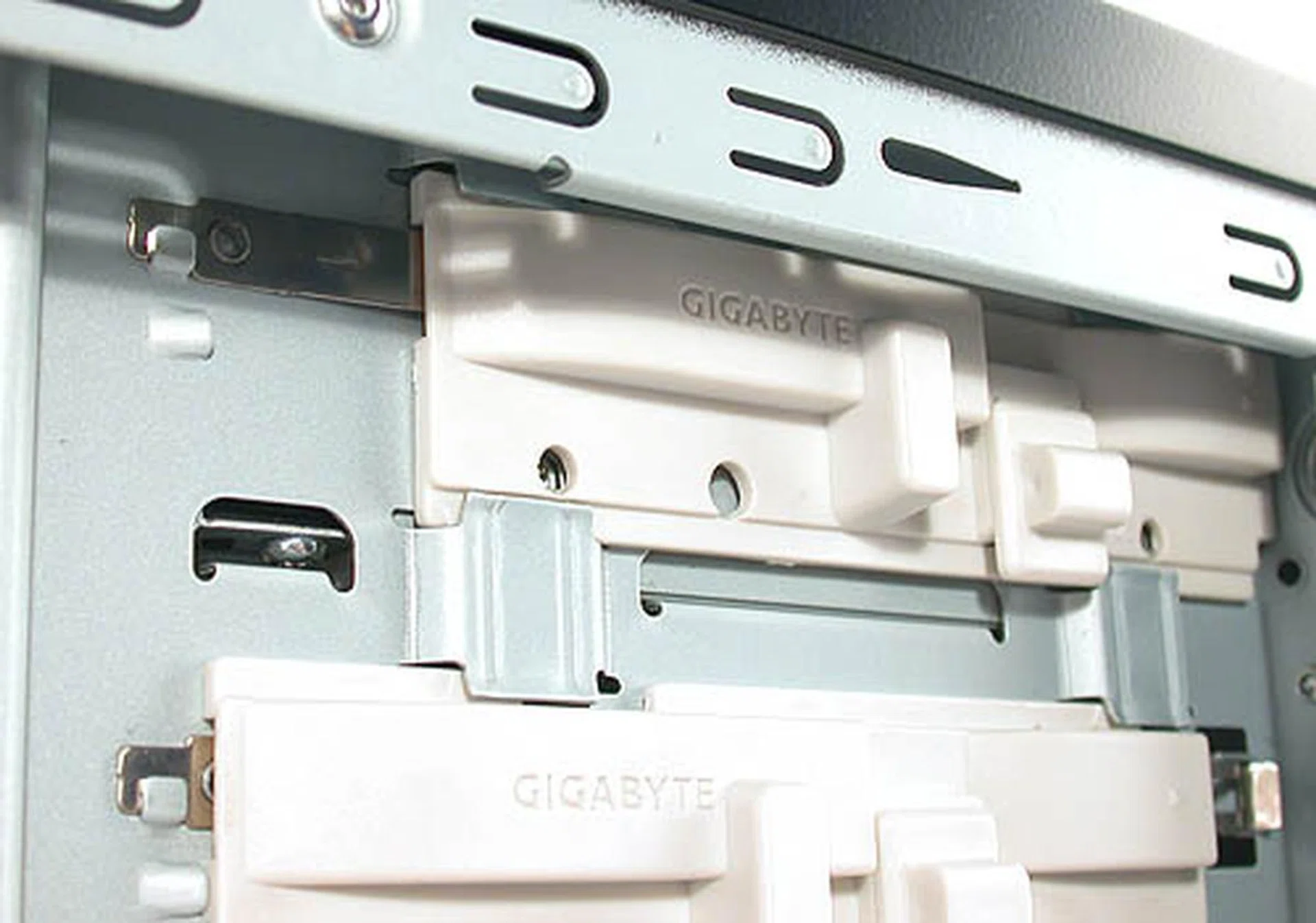 Push in and down, two easy steps to securing your 5.25-inch drives.