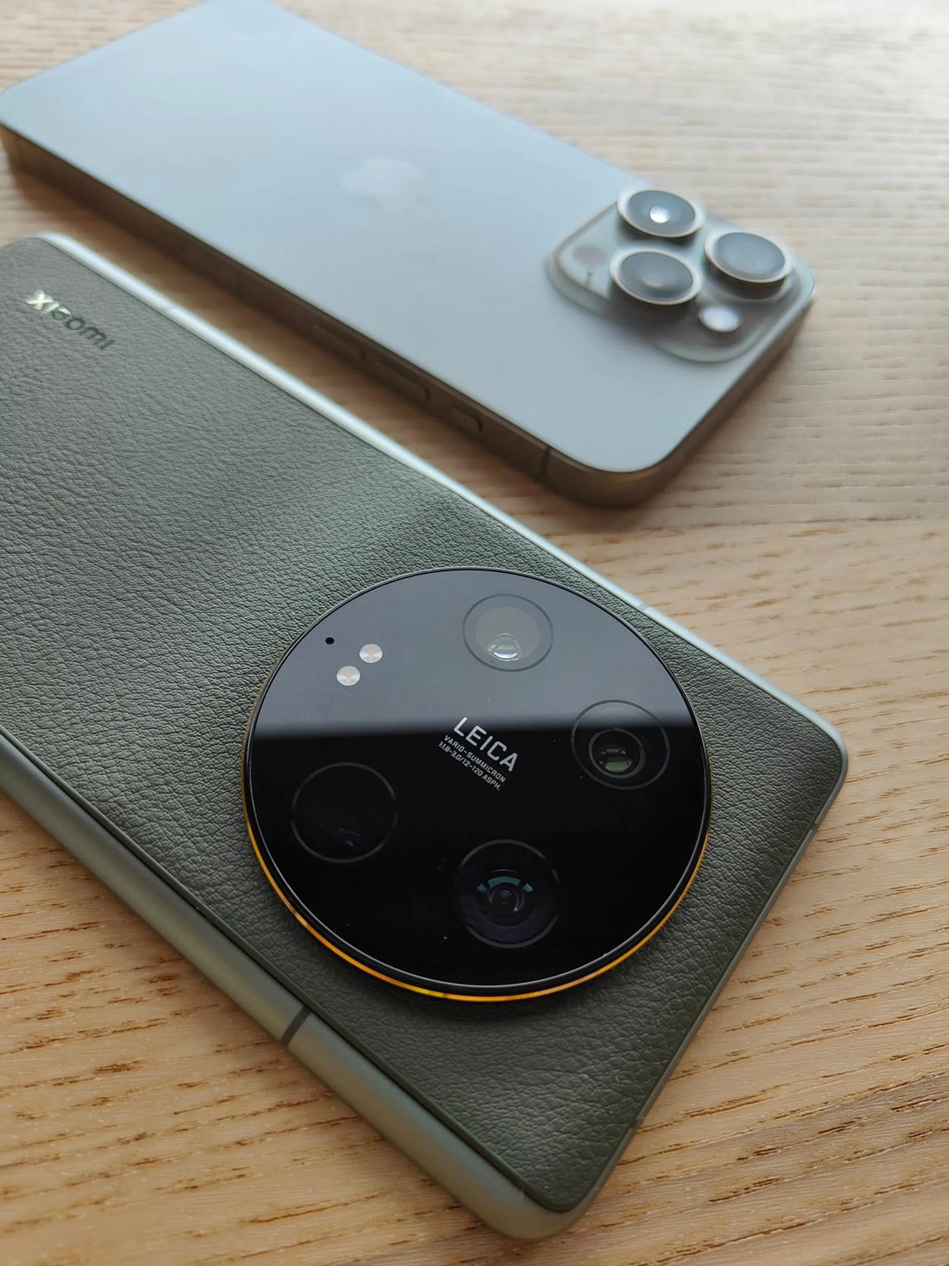 Xiaomi 13 Ultra next to the iPhone 15 Pro Max. Look at the size difference of their 'camera kit'.