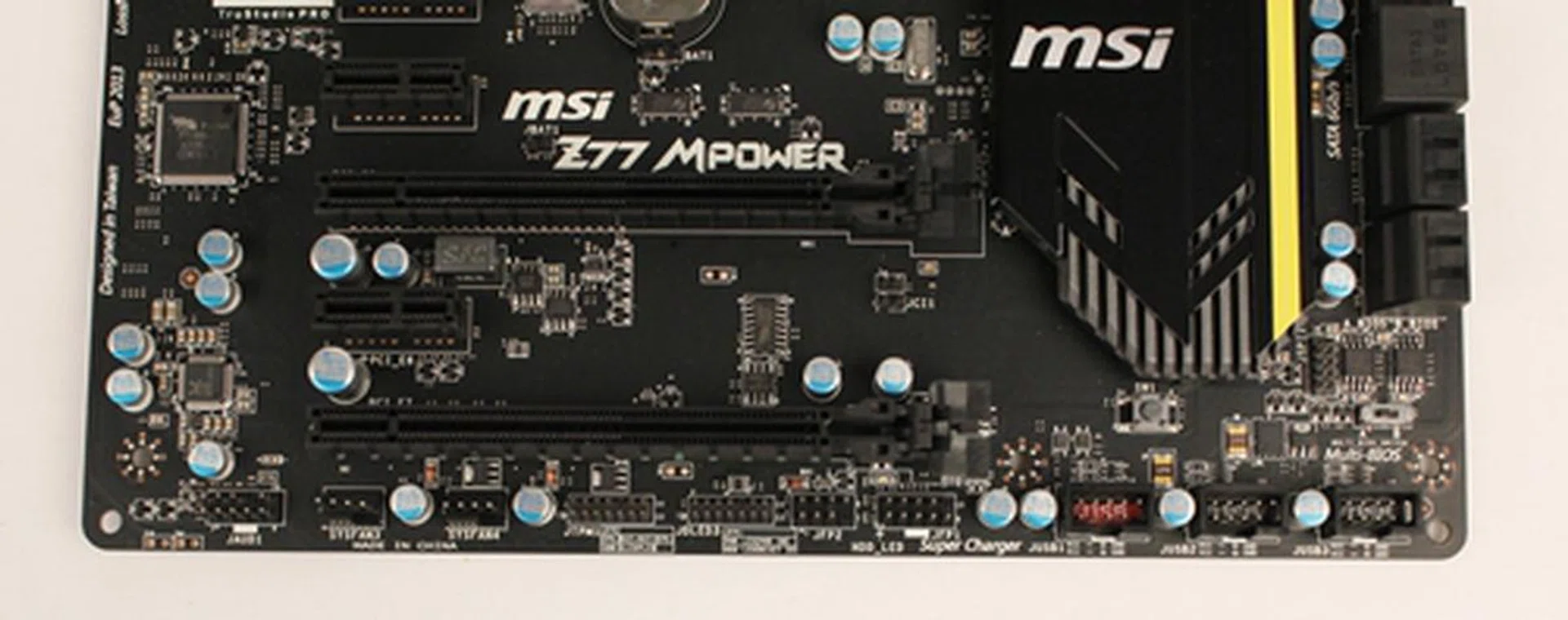 From the left are the front panel headers for audio, TPM, and system fan power connectors. The USB 2.0 and 3.0 expansion headers are to the right. They allow the connection of additional USB devices with their corresponding USB brackets (which are provided in the package). With MSI's SuperCharger application installed on the operating system, these connectors will provide quicker USB charging.