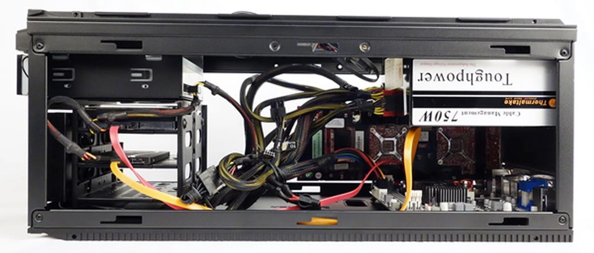 The PSU is mounted at the top of the chassis, over the mini-ITX board.