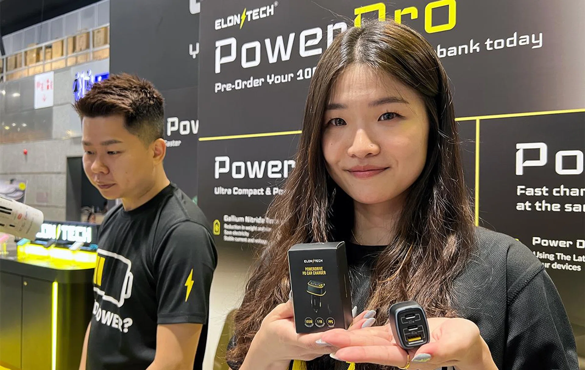 ElonxTech 105W PowerDrive Car Charger (foreground, in hand).