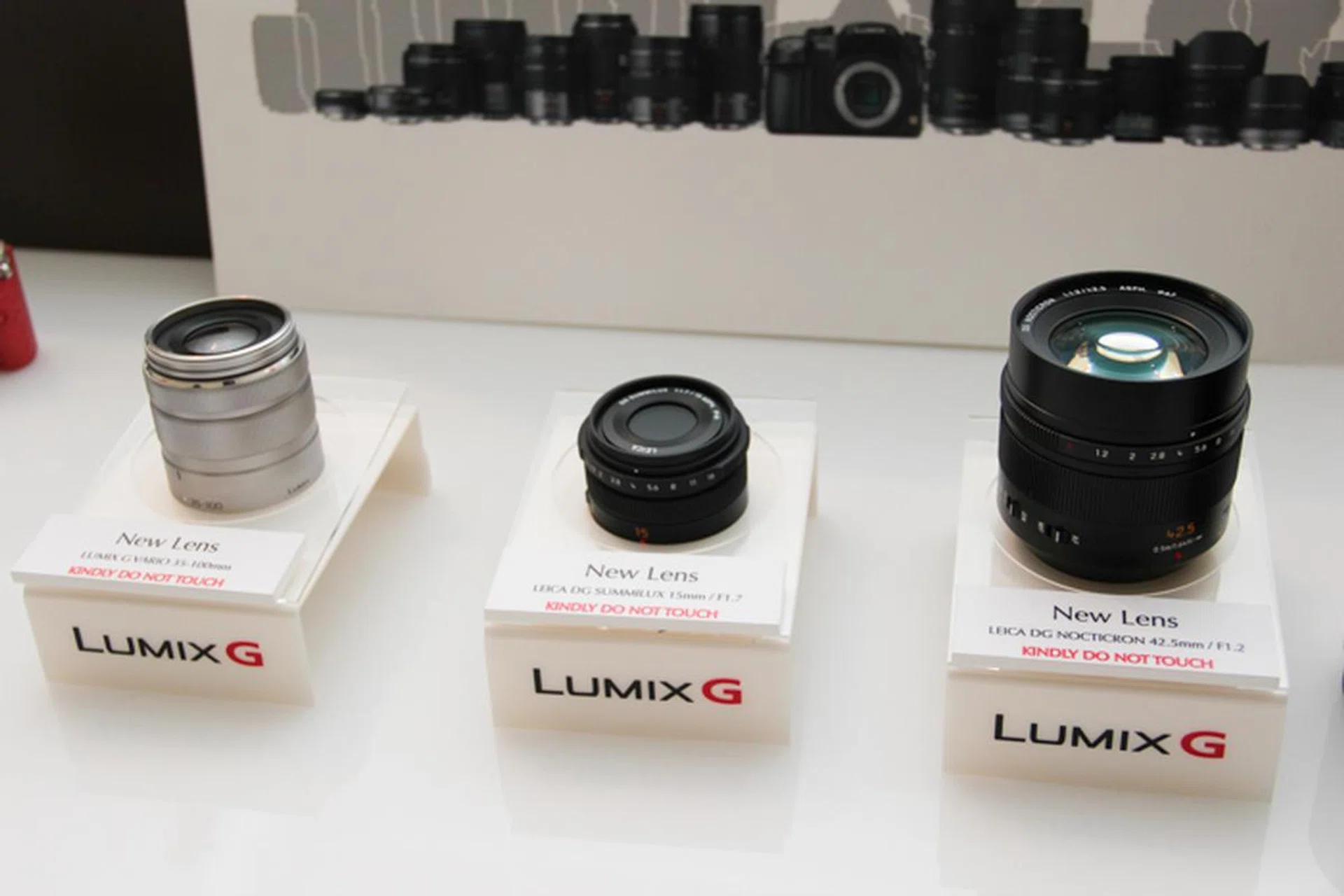 Also announced were two new lenses, a 35-100mm (left) and a 15mm f/1.7 (middle), to be released in 2014.