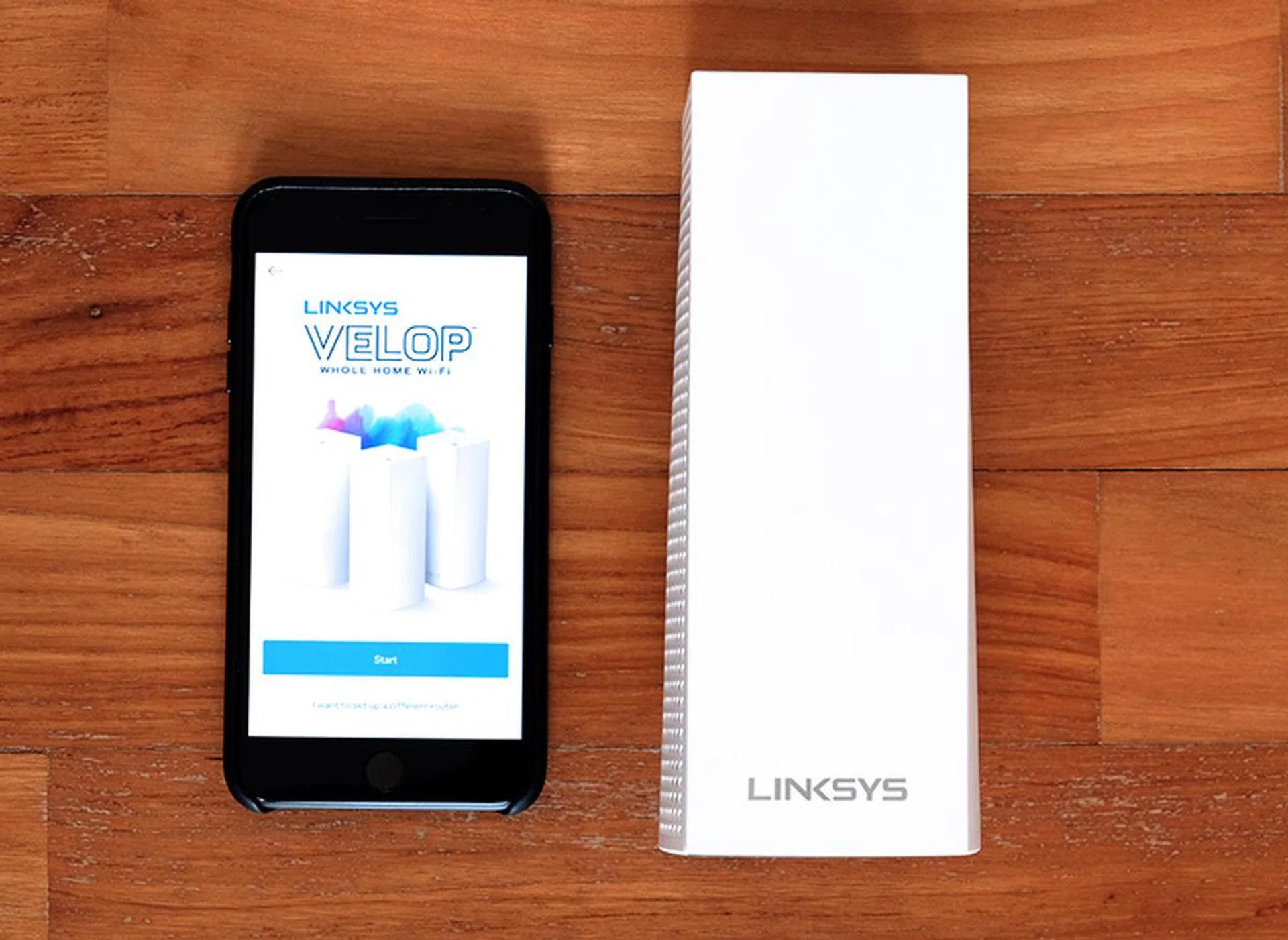 The Velop is really compact. Here it is next to an iPhone 7 Plus.