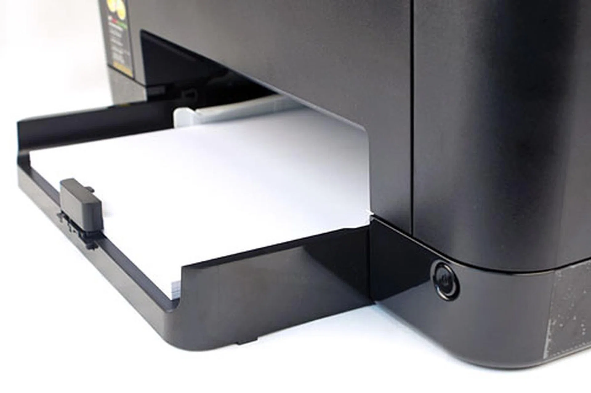 The input tray at the front accepts up to 150 sheets of paper. In this picture, you can also see the power button at the bottom right corner.