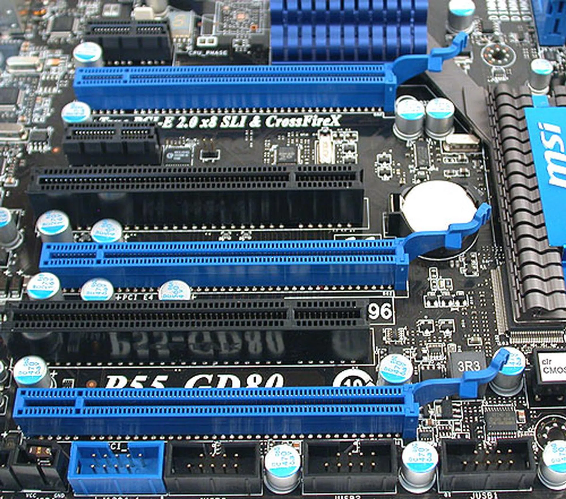 Nothing unusual here as the three PCIe graphics slots are found on almost every P55 motherboard we have seen today. Like the others, the last (lowest in the image) PCIe slot is at x4 speed. And since it shares the lanes with the PCIe x1 slots, you can't have any cards installed in the PCIe x1 slots when using the PCIe x4 slot. 