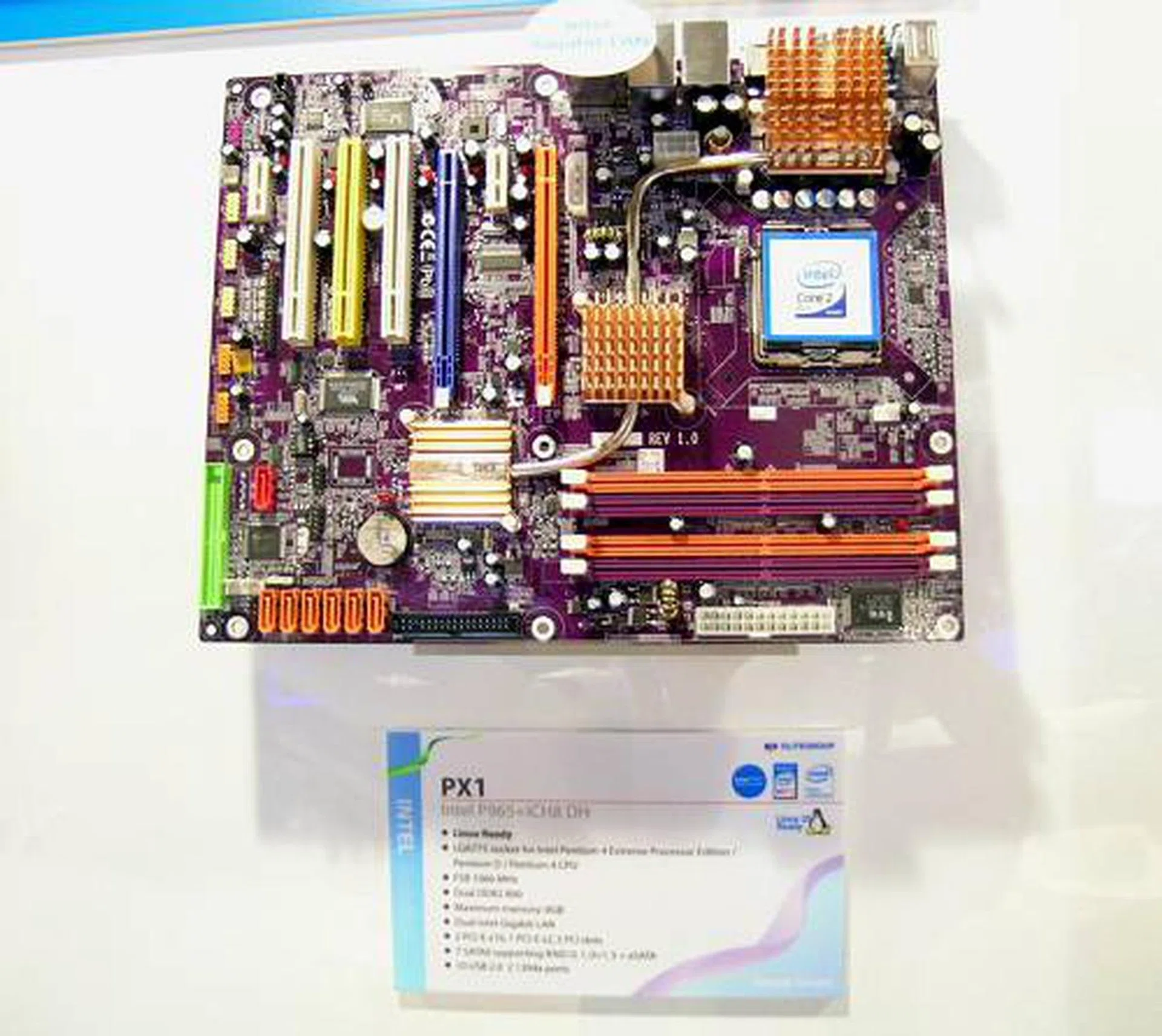 Static shot of the PX1 shows even ECS going into the heat-pipe cooling bandwagon, though the rear radiator spills out into the I/O panel. The PX1 has dual PCIe x16 slots, Dual Gb LAN, and seven SATA 3.0Gbps ports plus one eSATA. 