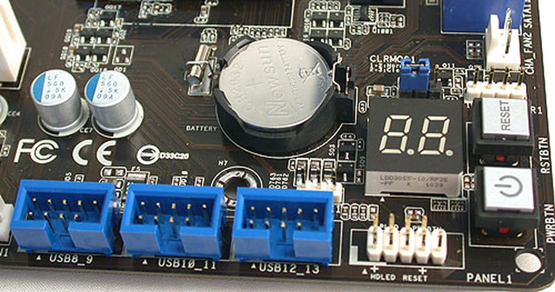 Onboard power, reset and a debugging LED are all present. There's also an onboard Clear CMOS jumper to complement the button at the rear panel. Lots of USB 2.0 headers too. 