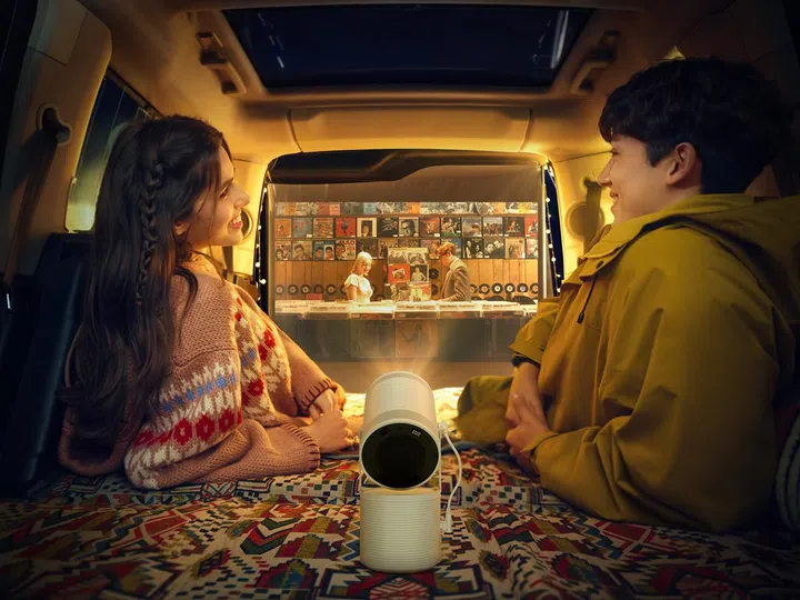 Want to project movies out from the back of a car to a wall or a white cloth hanging from the open boot? Yes, The Freestyle can do it. (Image source: Samsung)